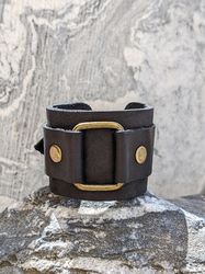 Leather wristband, handcrafted accessory, black cuff
