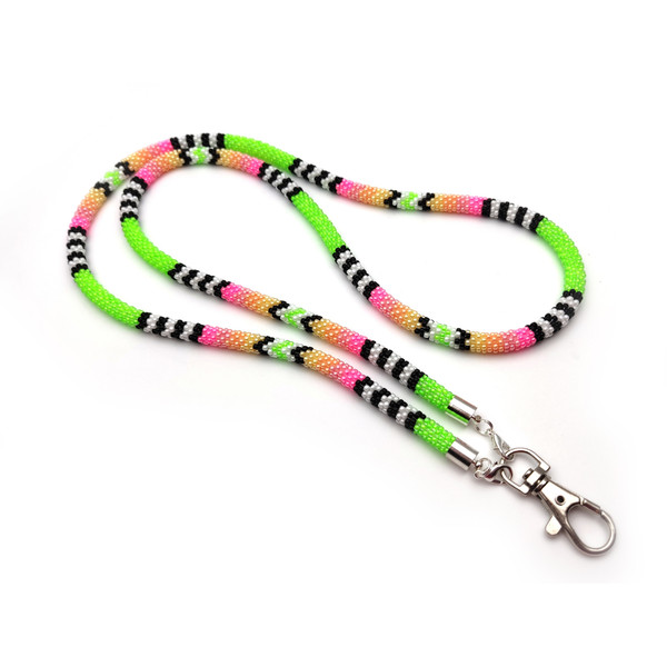 Native American-style pink and green lanyard