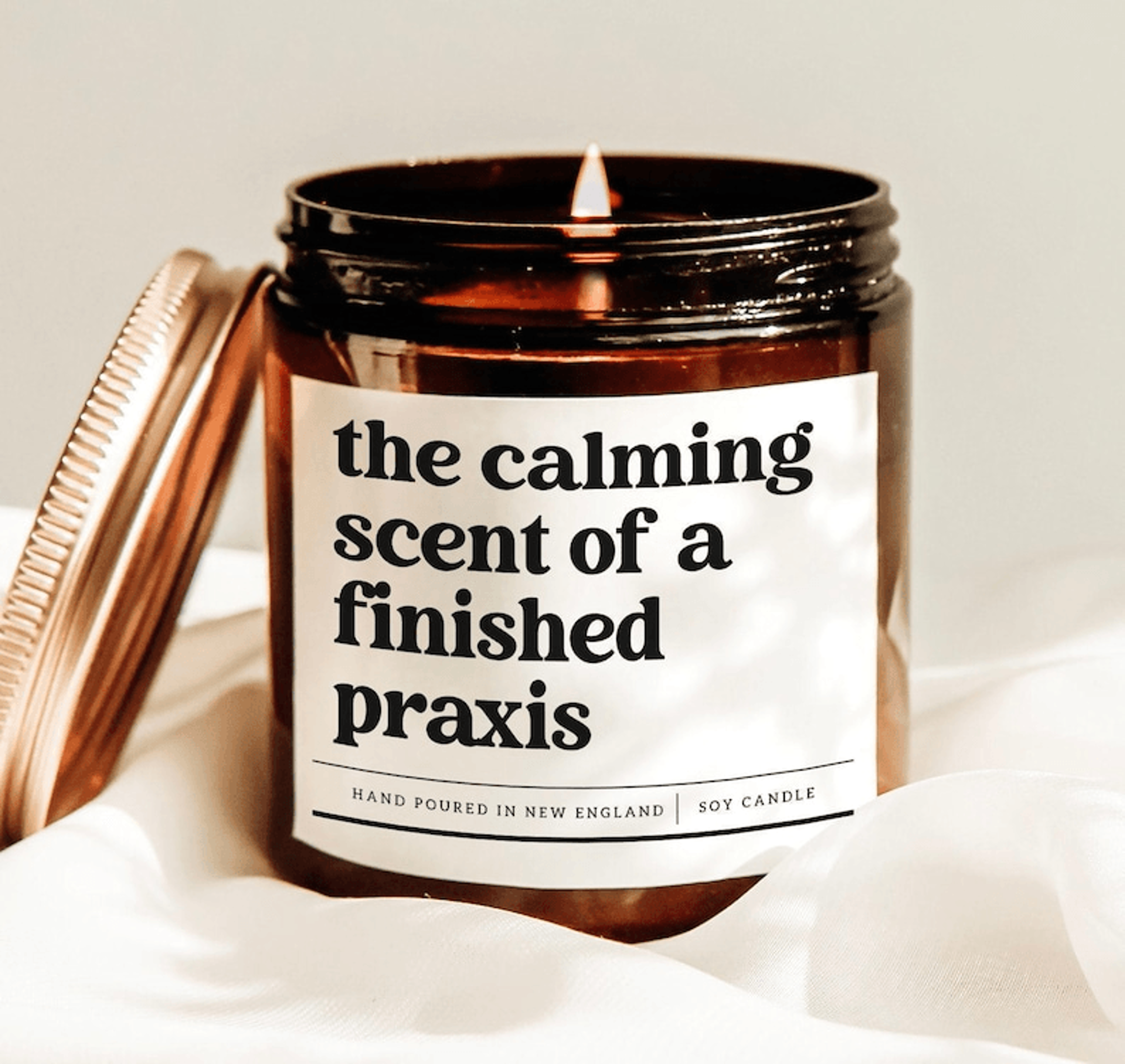 the calming scent of a finished praxis candle, teacher exam graduation gift, funny teacher soy candle decor