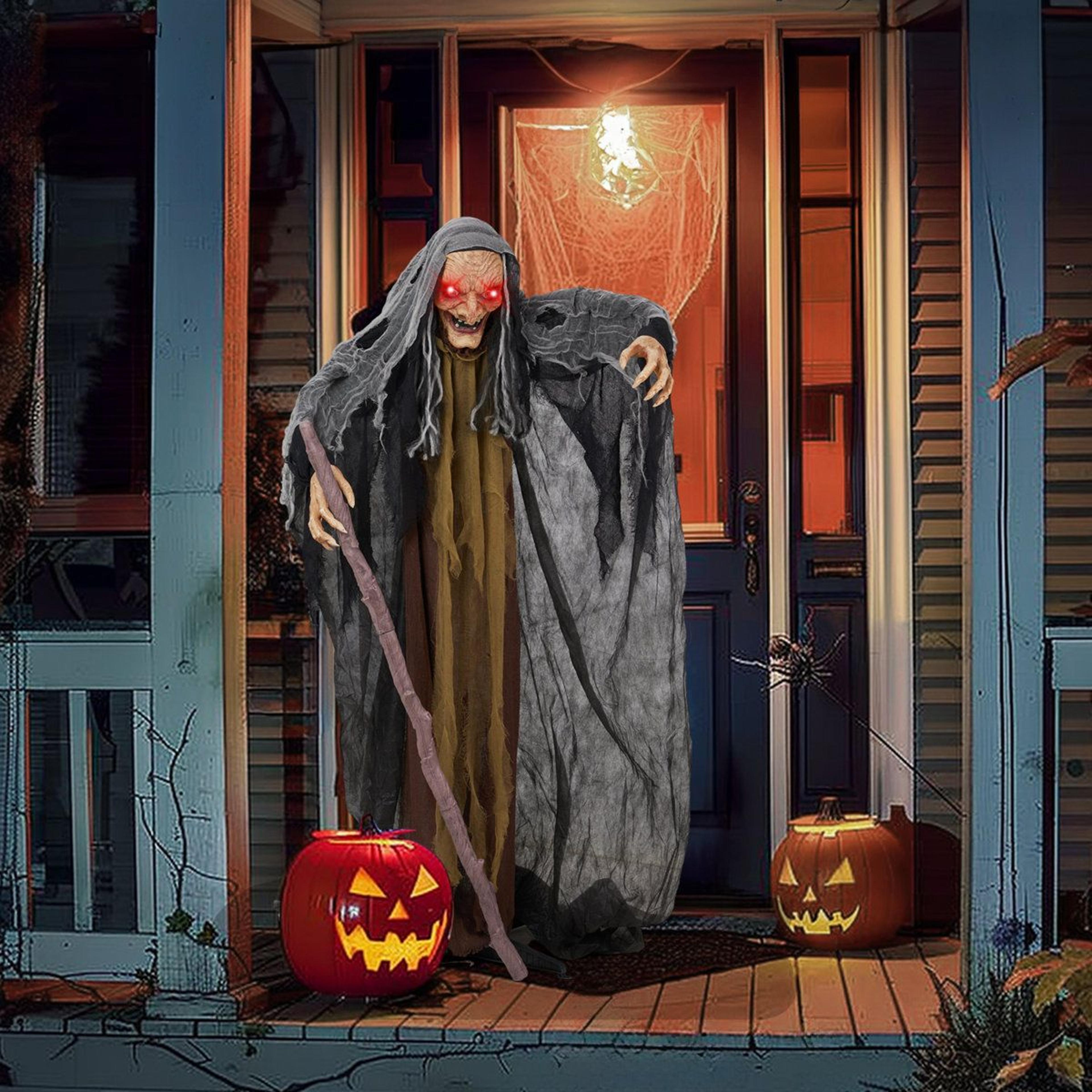 animated standing witch decoration with glowing red eyes and sound