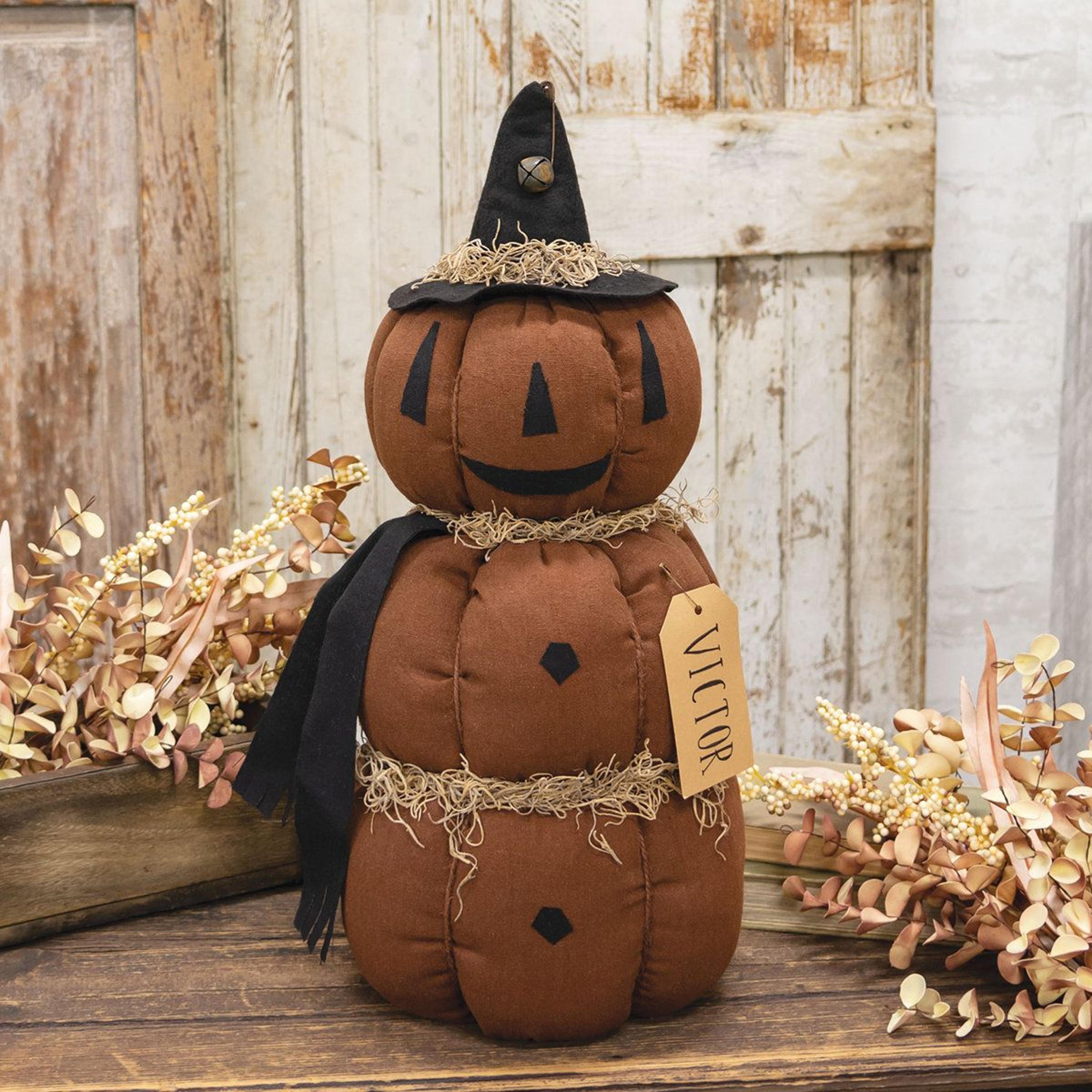 halloween stacked pumpkin figurine with black witch hat and plush fabric design