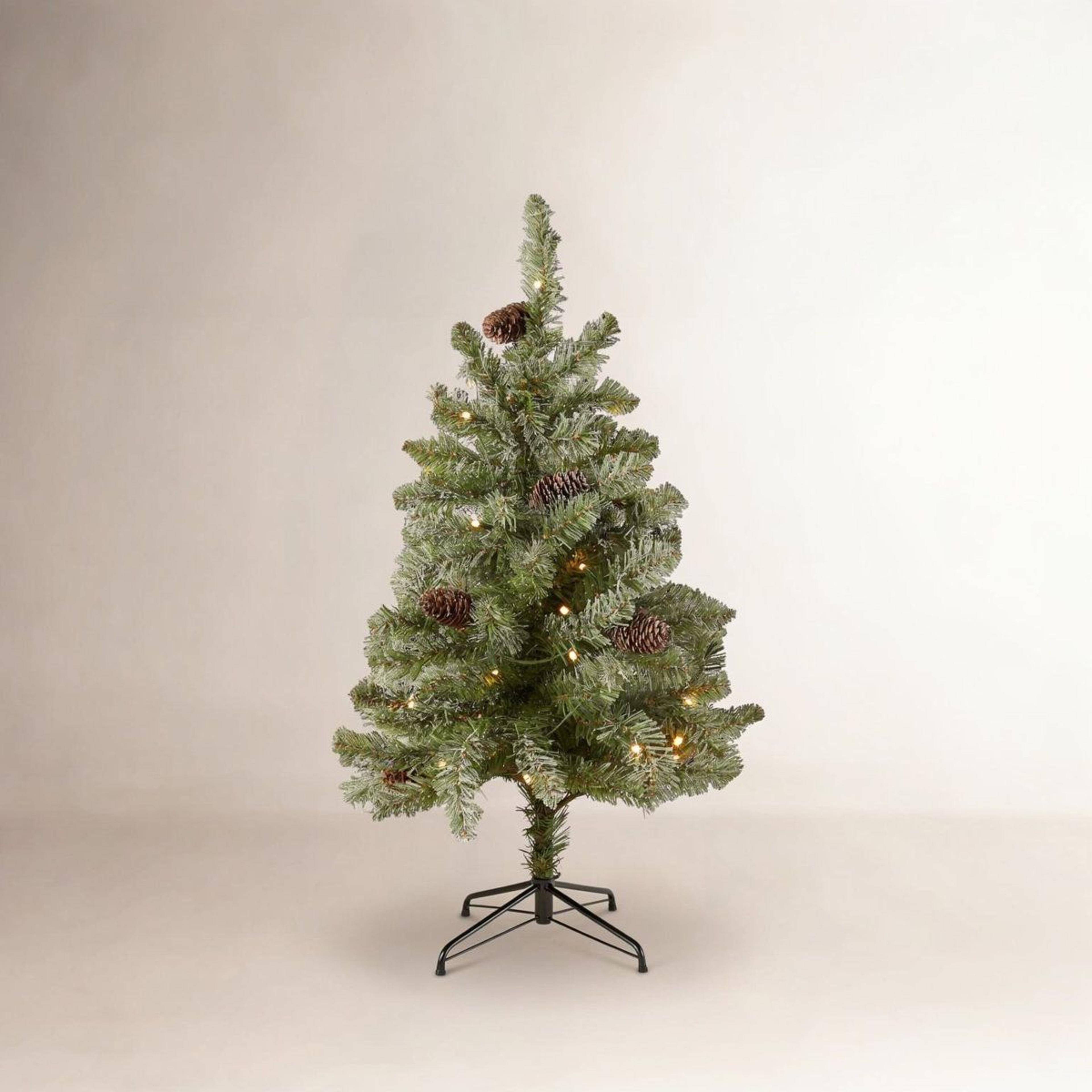pre-lit flocked fir christmas tree with warm white led lights and pinecones