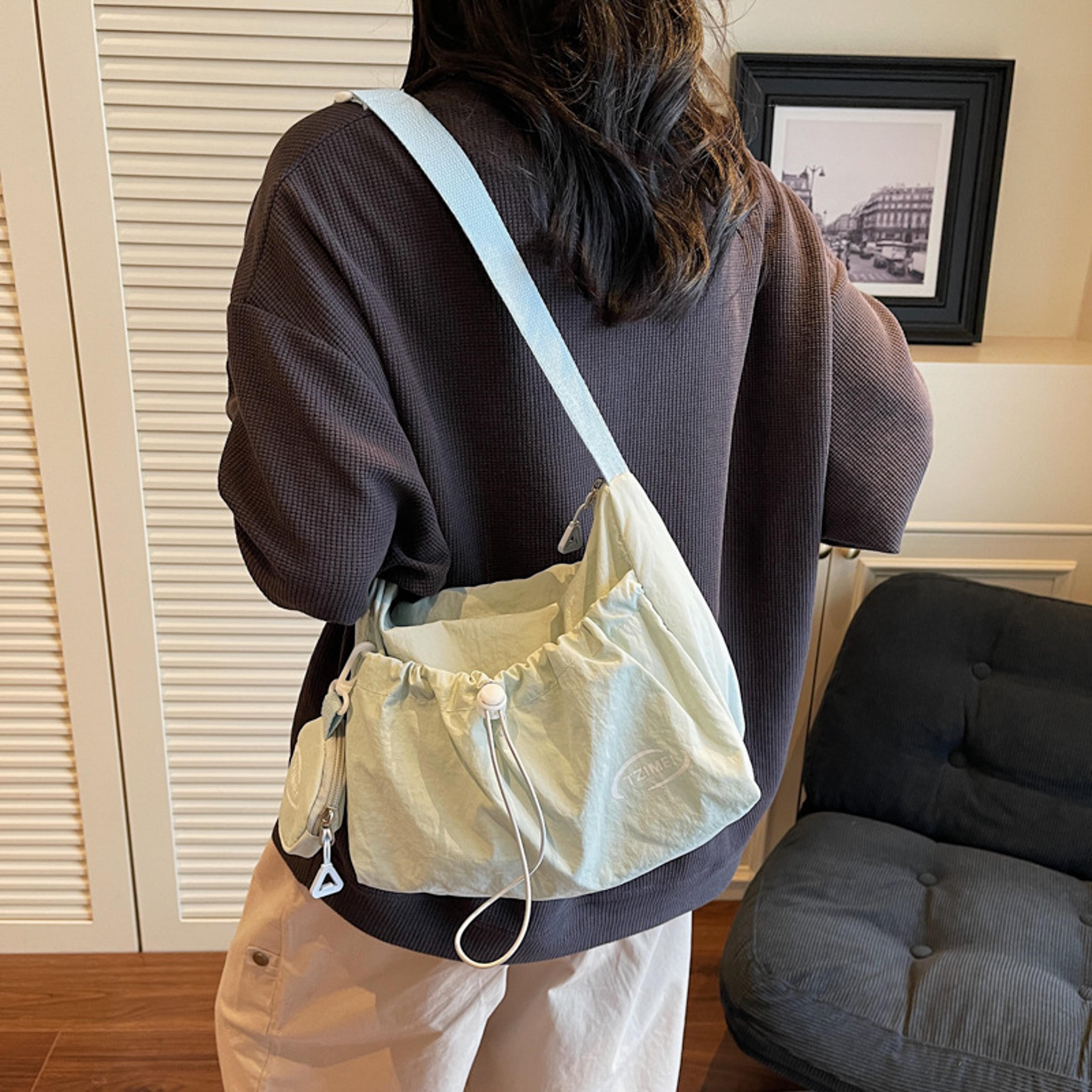 chic nylon crossbody bag with detachable pouch and adjustable strap