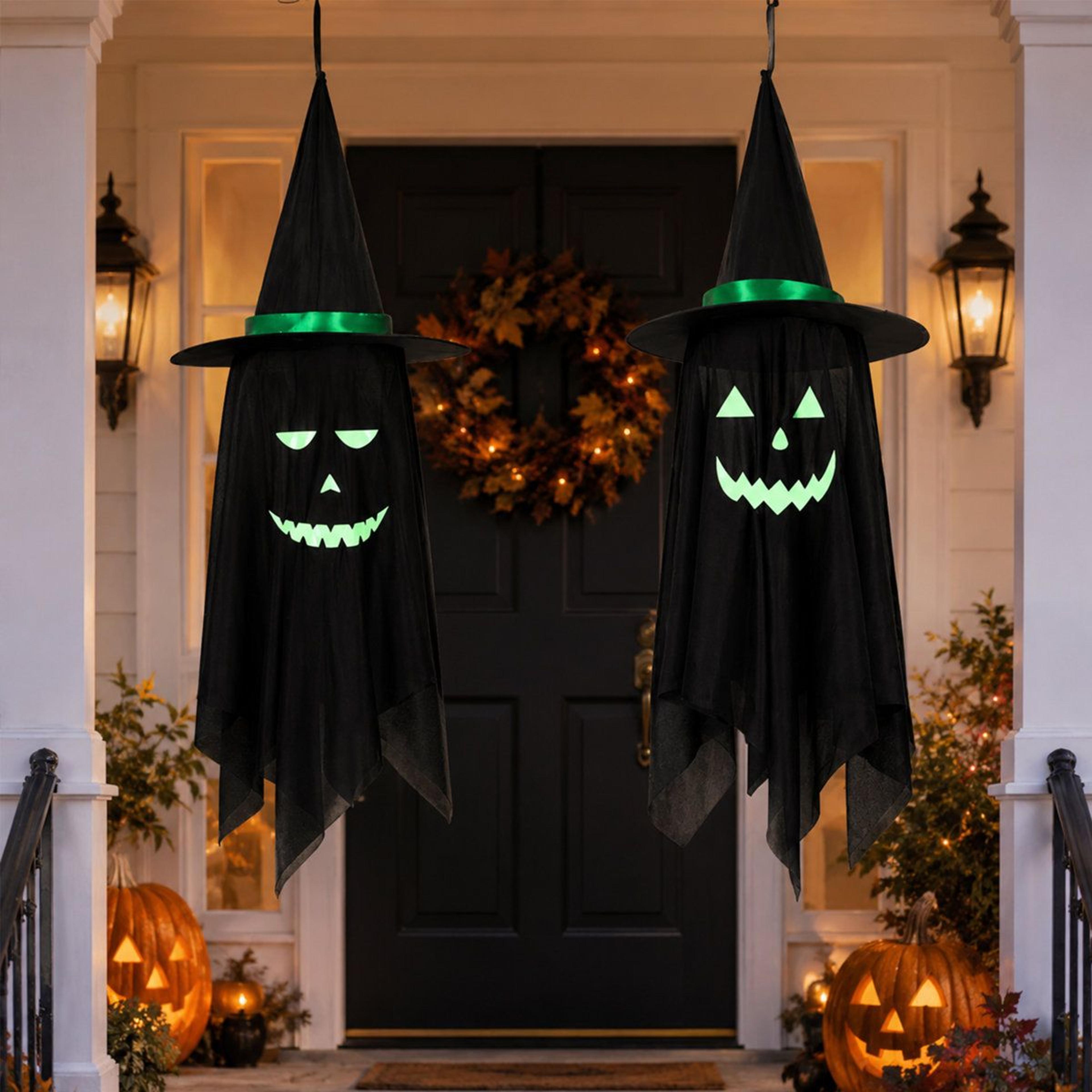halloween hanging ghost decorations with witch hats and glow in the dark face stickers