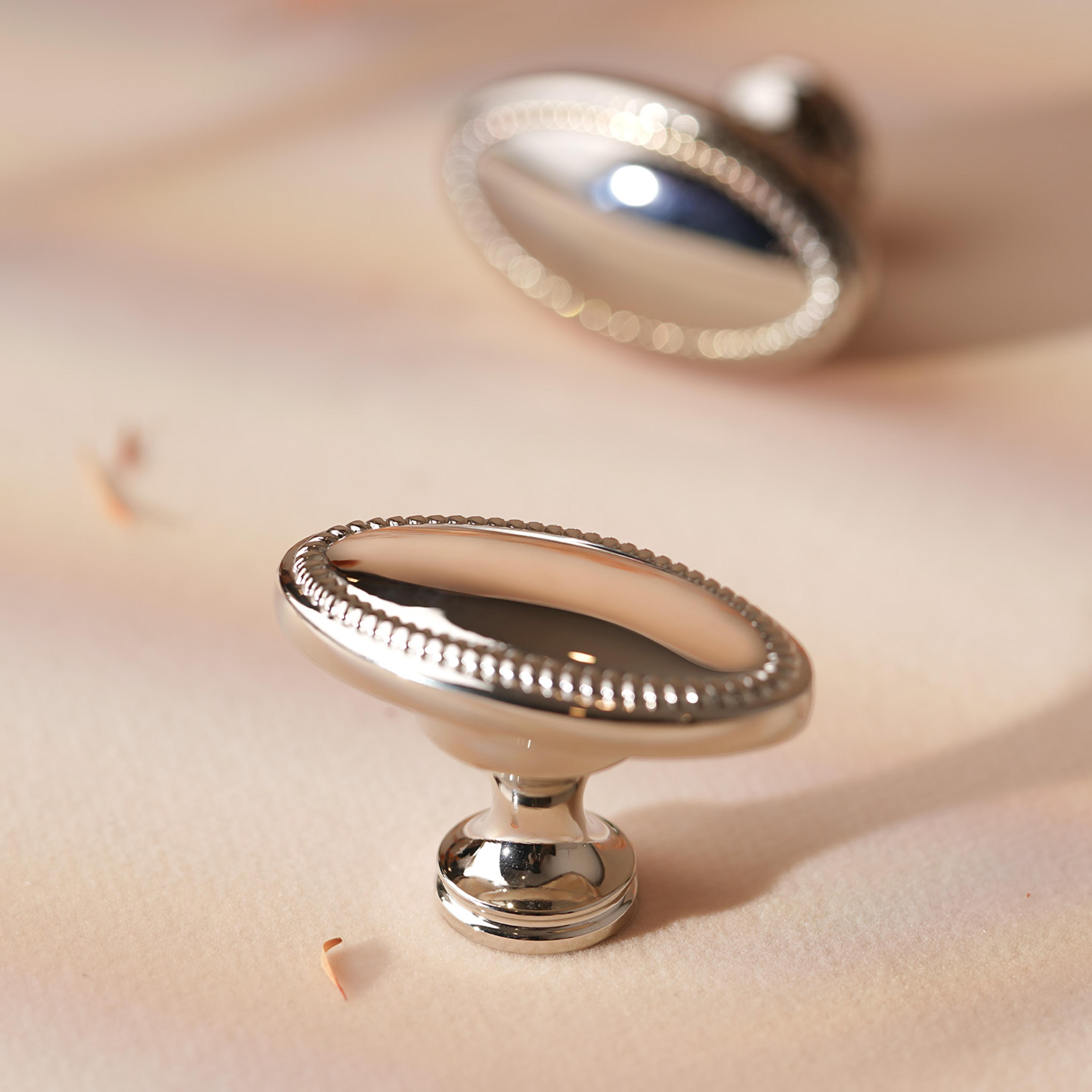 bright nickel oval brass cabinet knob with beaded edge