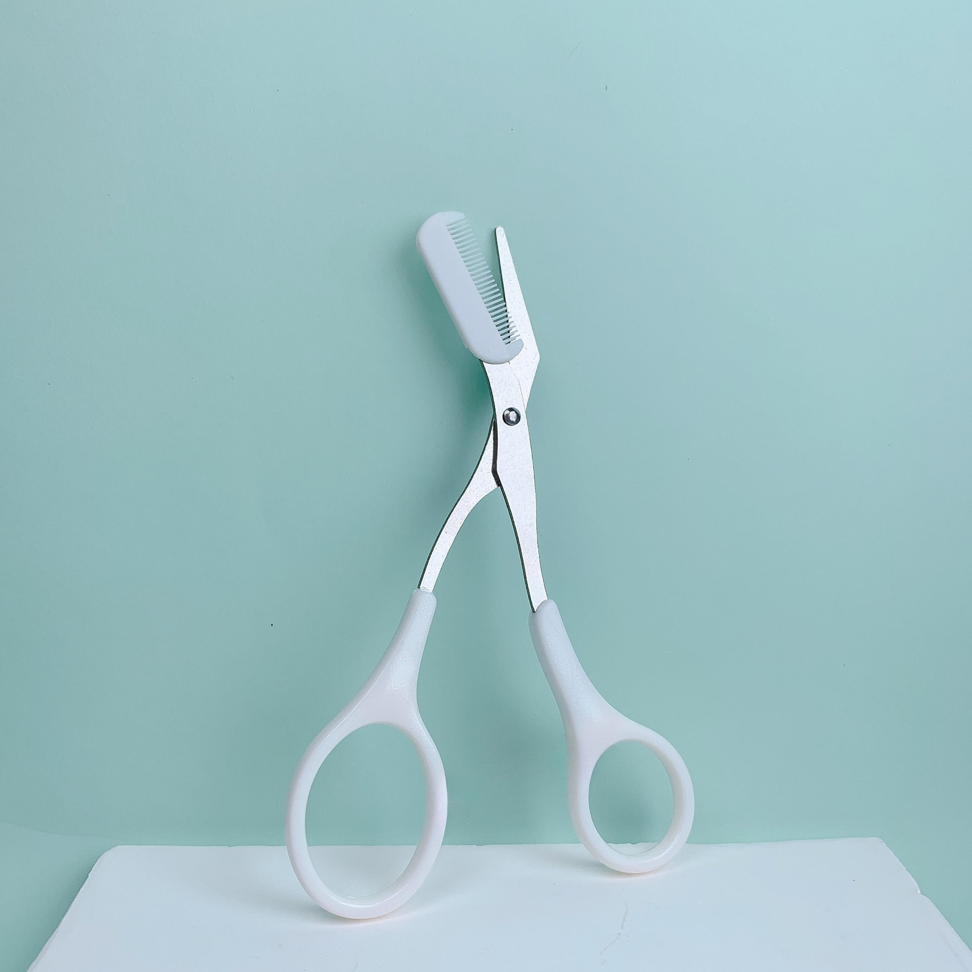precise grooming tool for creating perfect eyebrows, pink eyebrow trimming scissors, built in comb stainless steel