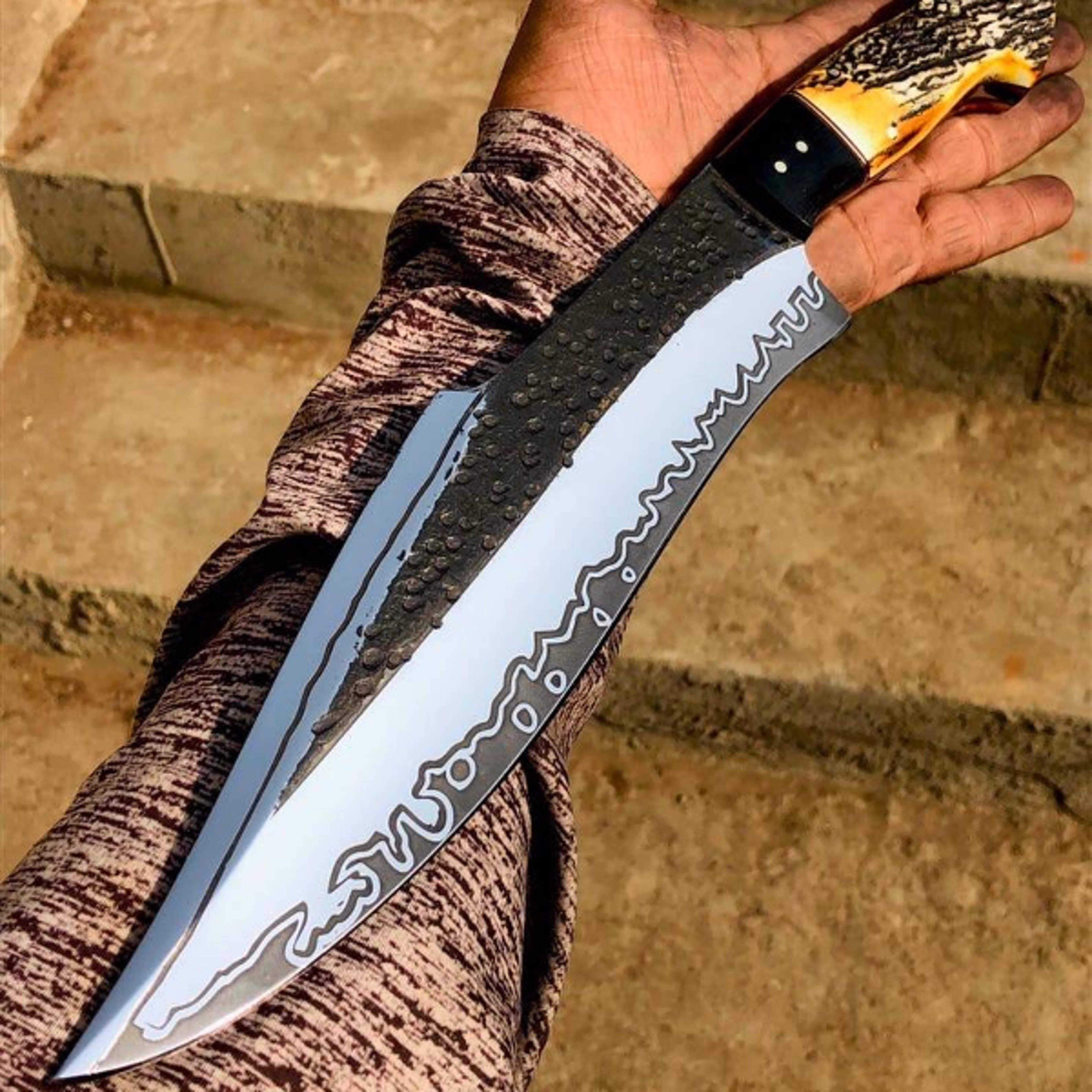 handcrafted carbon steel bowie knife with wooden handle and leather sheath for hunting and outdoor adventures