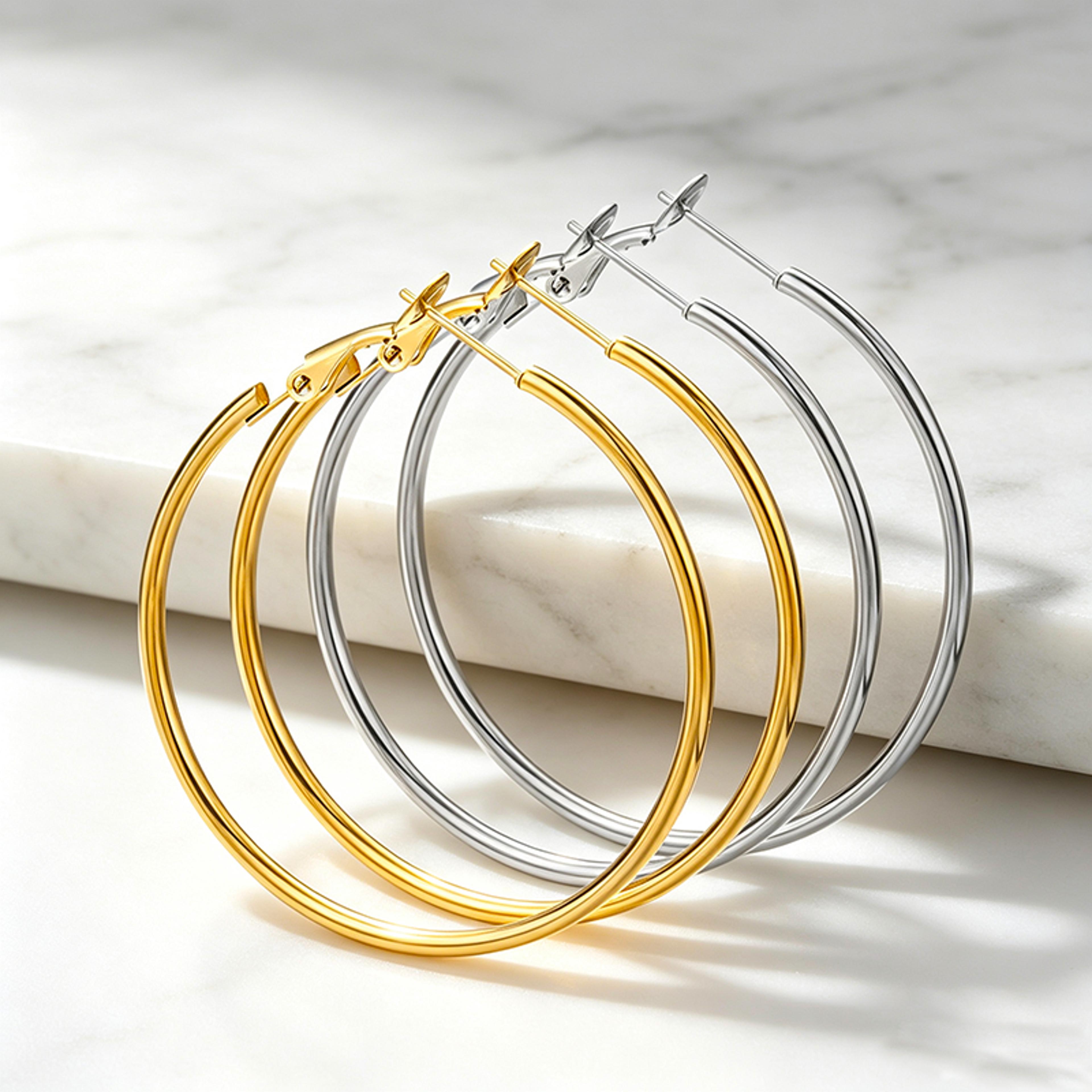 stainless steel hoop earrings set with gold and silver lever back hoops