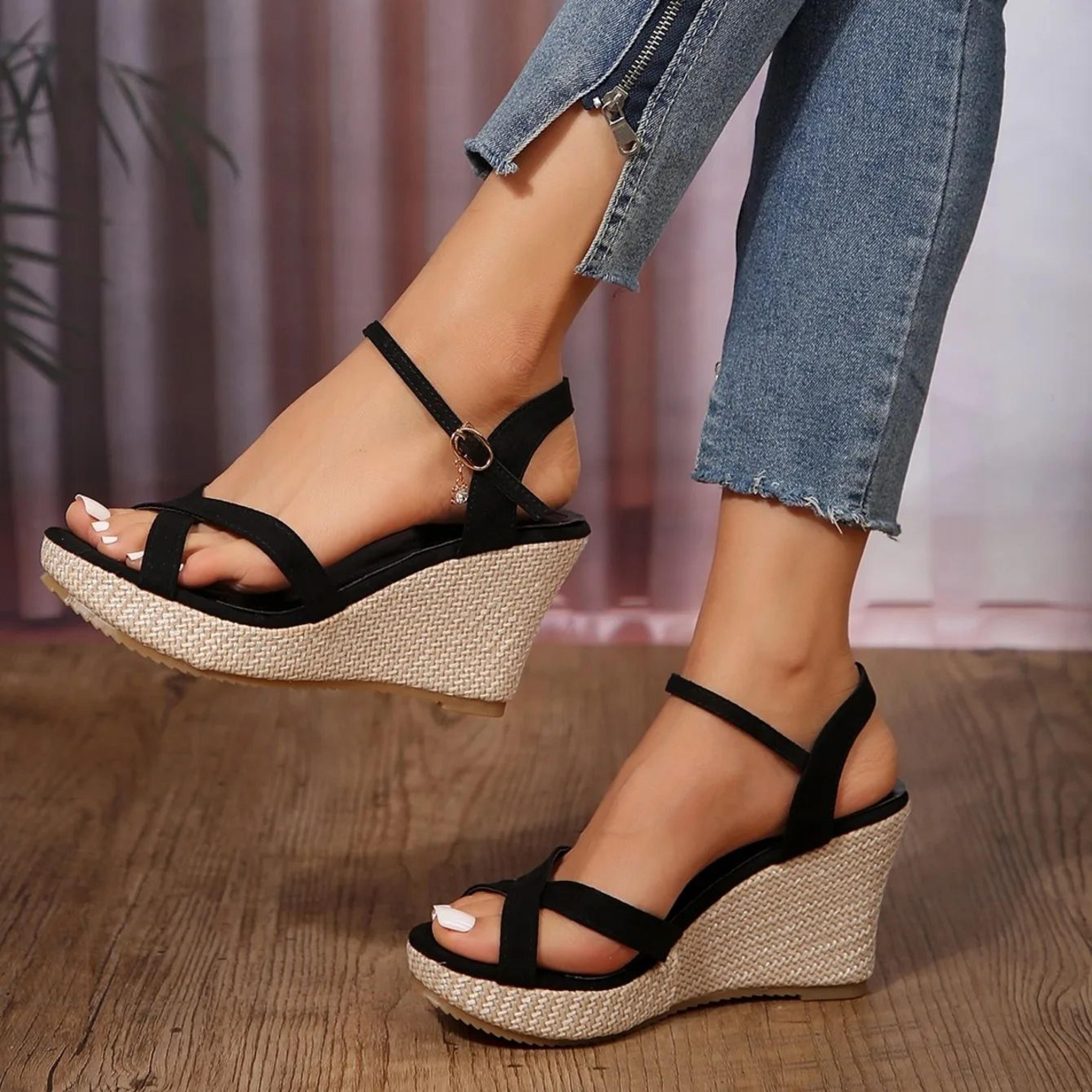 platform heel with criss cross straps & open toe design