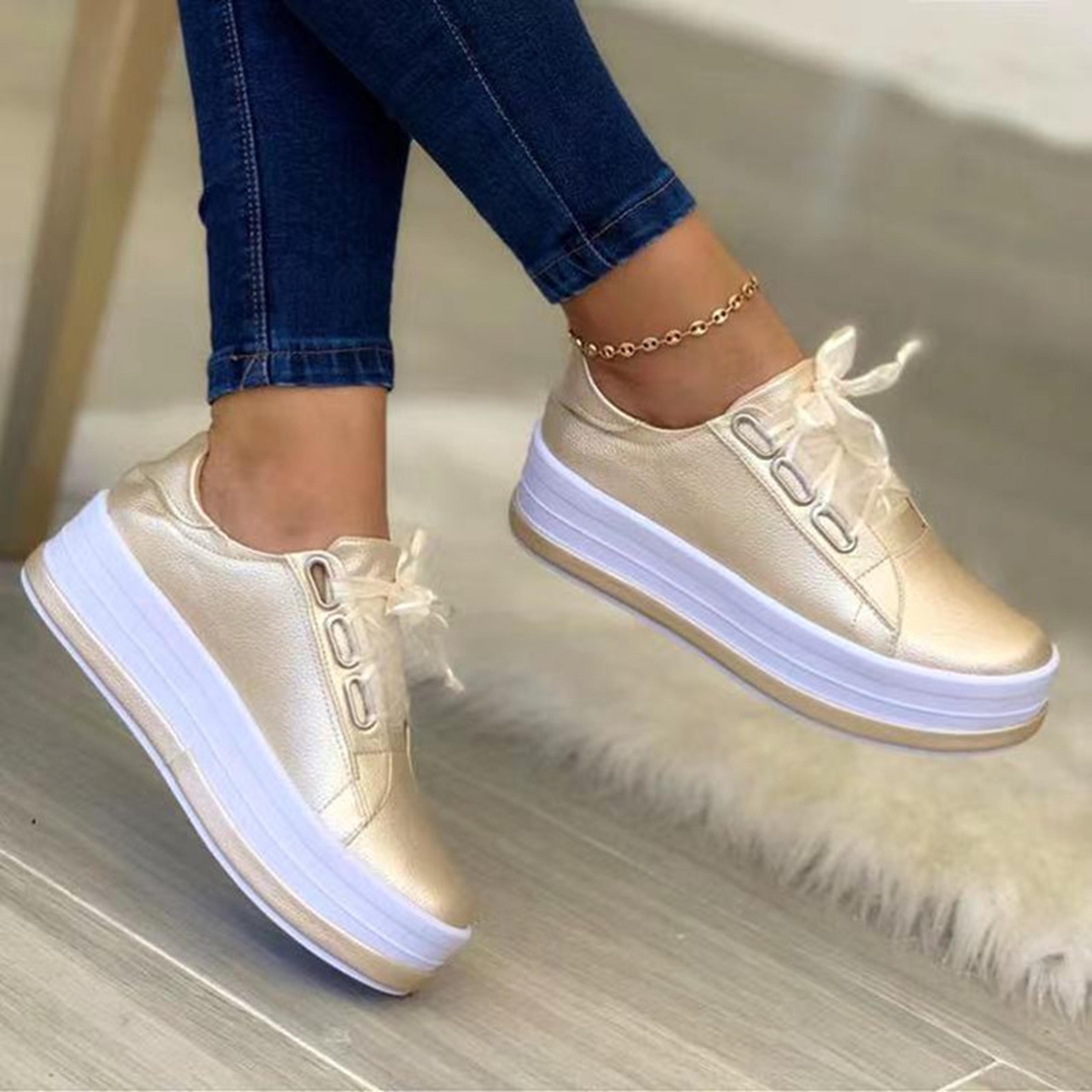 womens platform sneakers with lace up closure and thick rubber soles