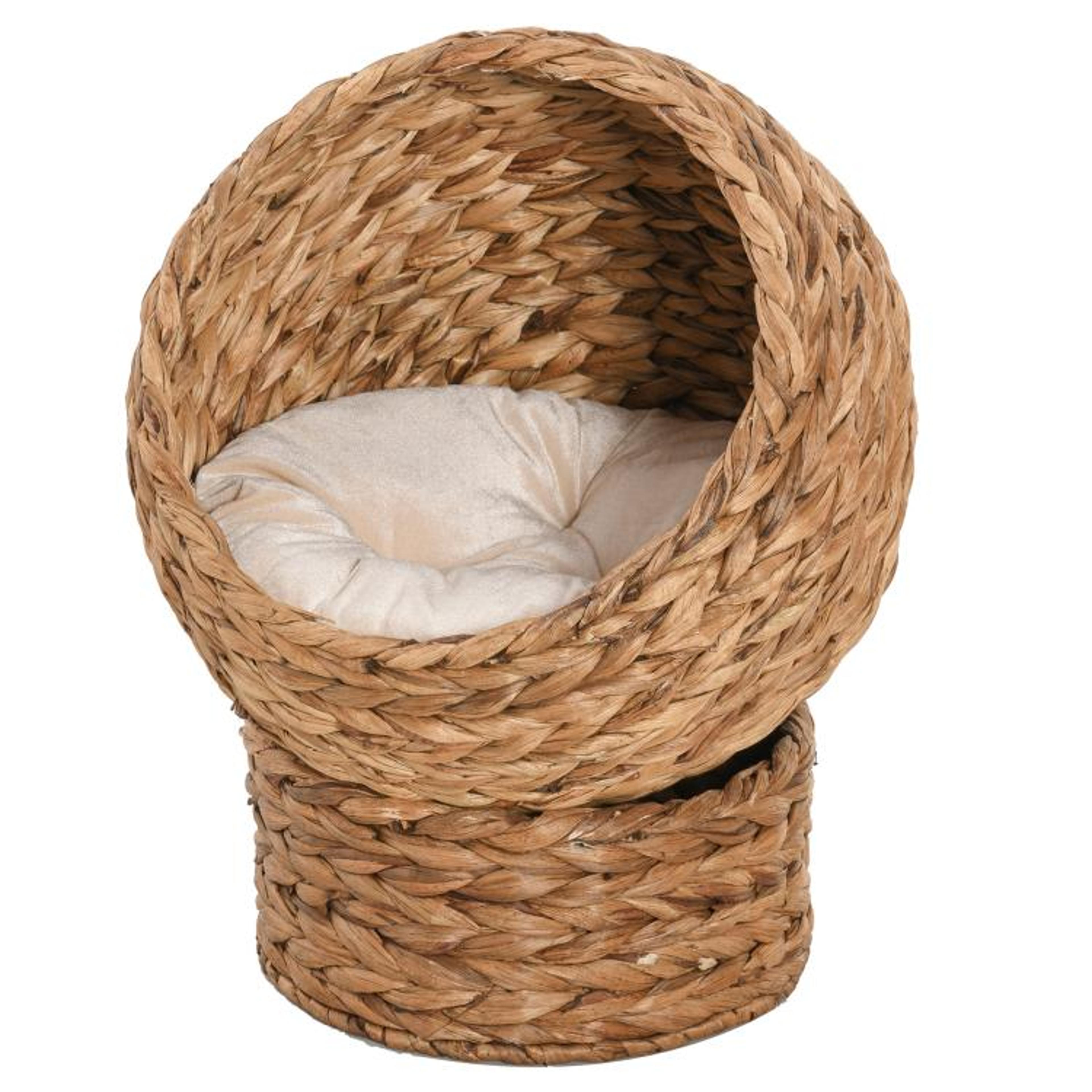 elevated cat bed with soft cushion and rotating woven egg basket
