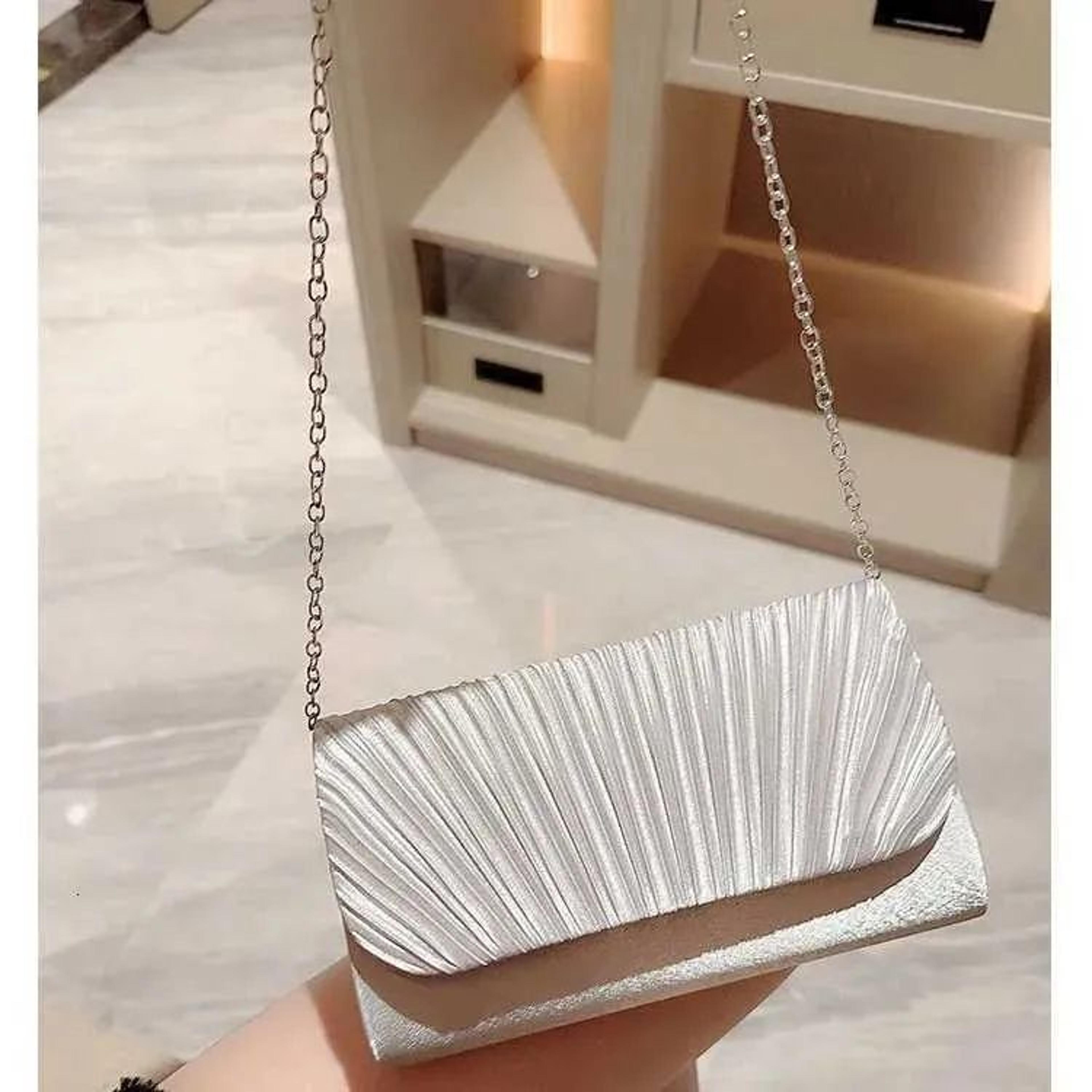 elegant textured shoulder bag with fold over design for evening parties