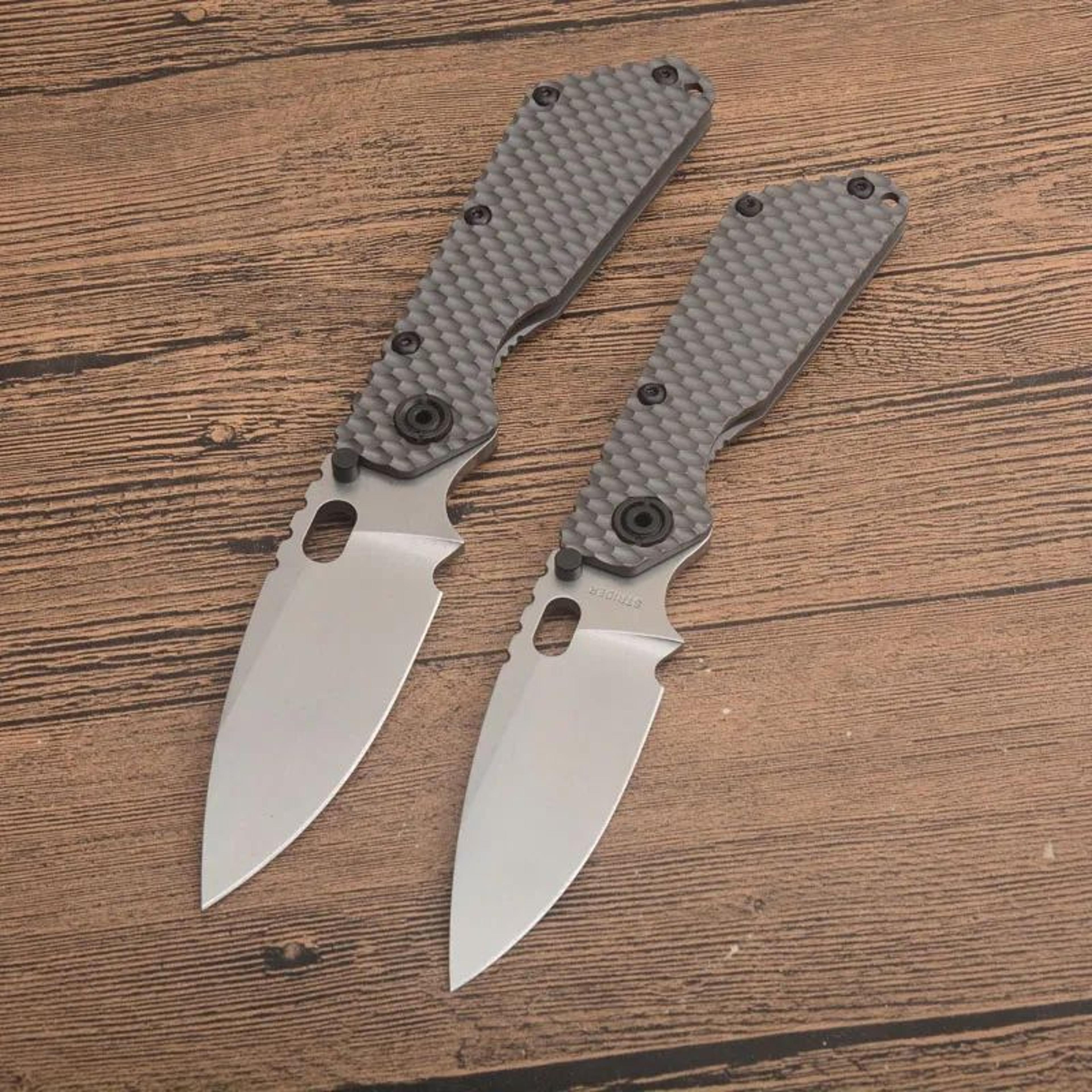 steel folding pocket knife with titanium alloy handle and stonewashed blade