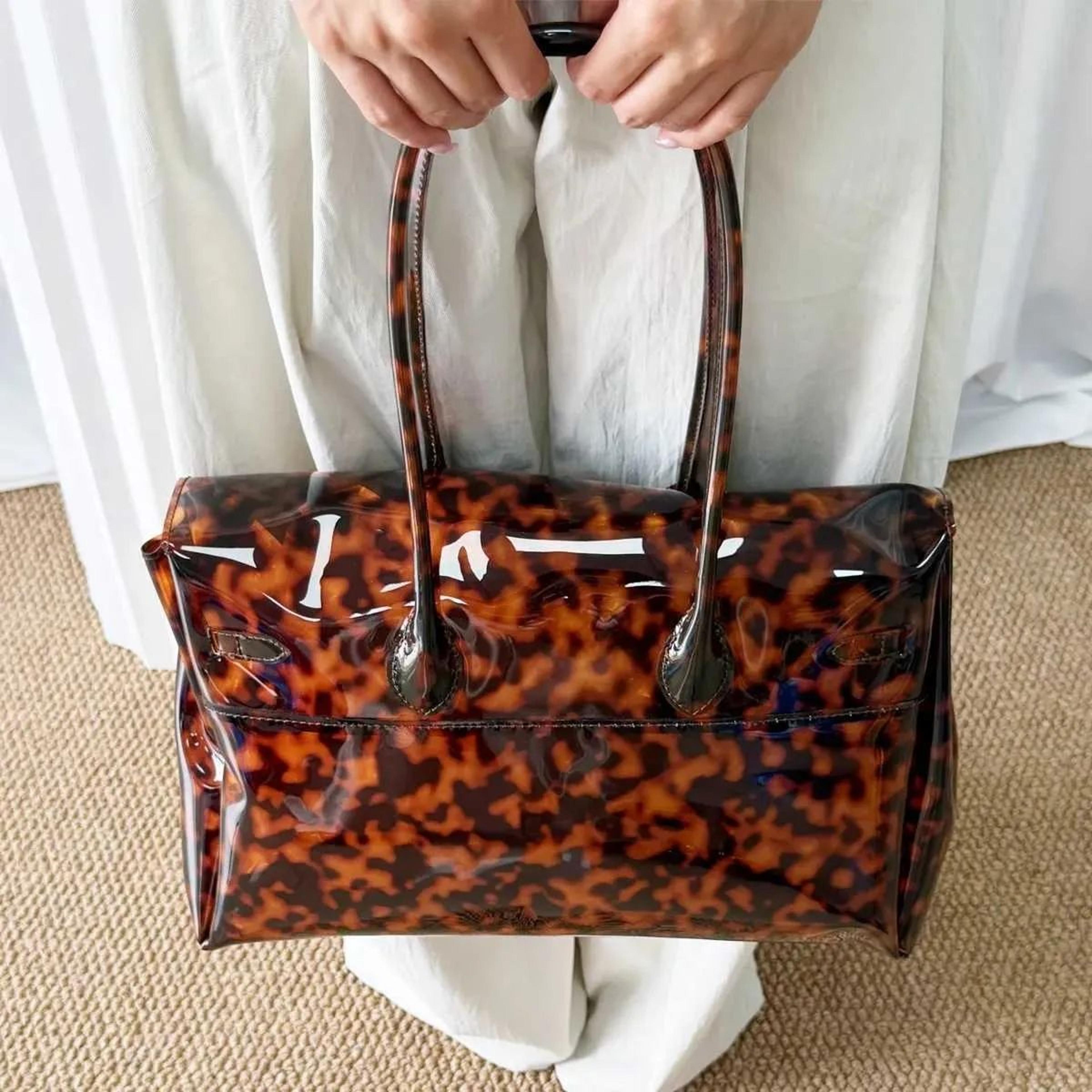 women's transparent jelly tote bag with crocodile texture and tortoiseshell accents