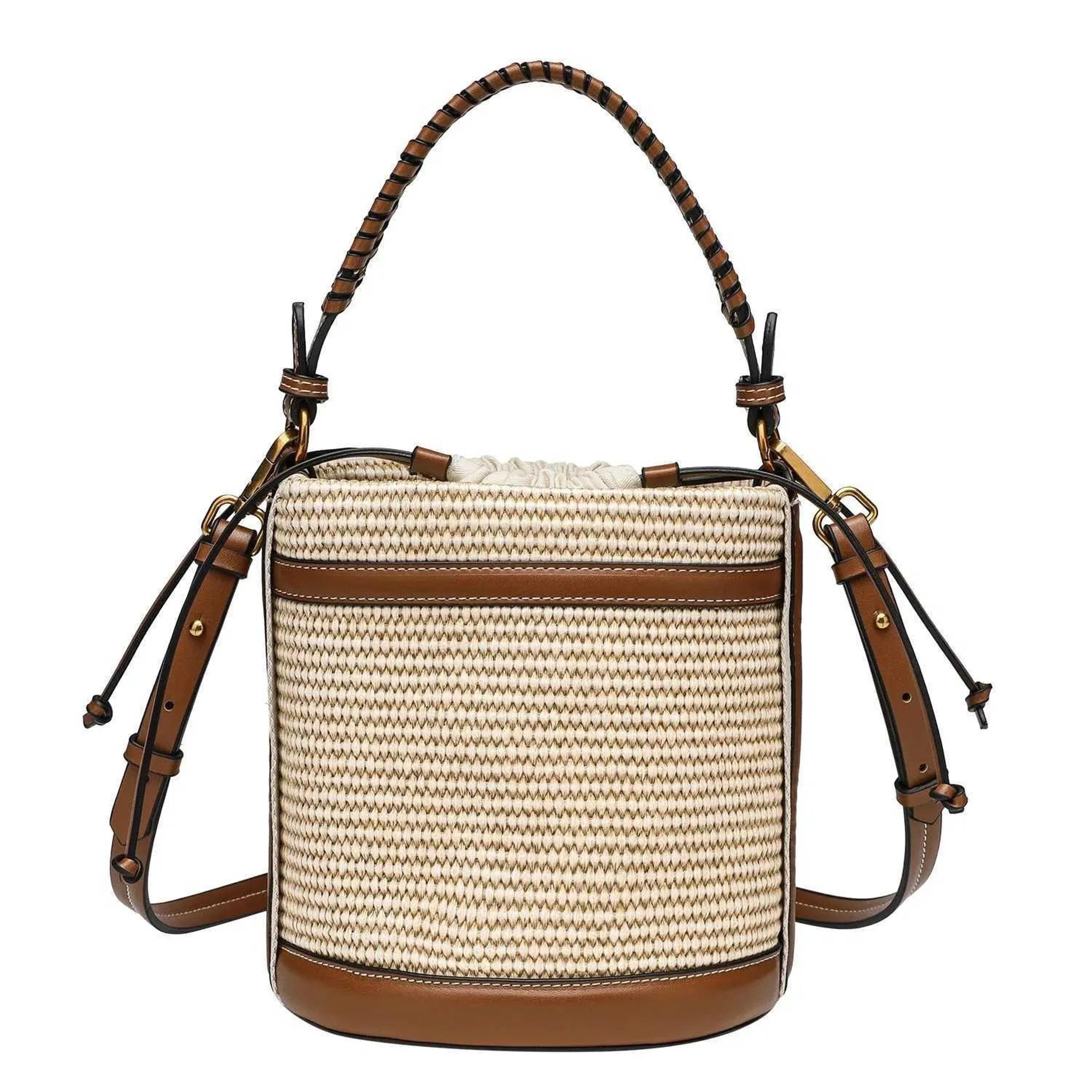 women's straw style bucket bag with woven paneled design and crossbody strap