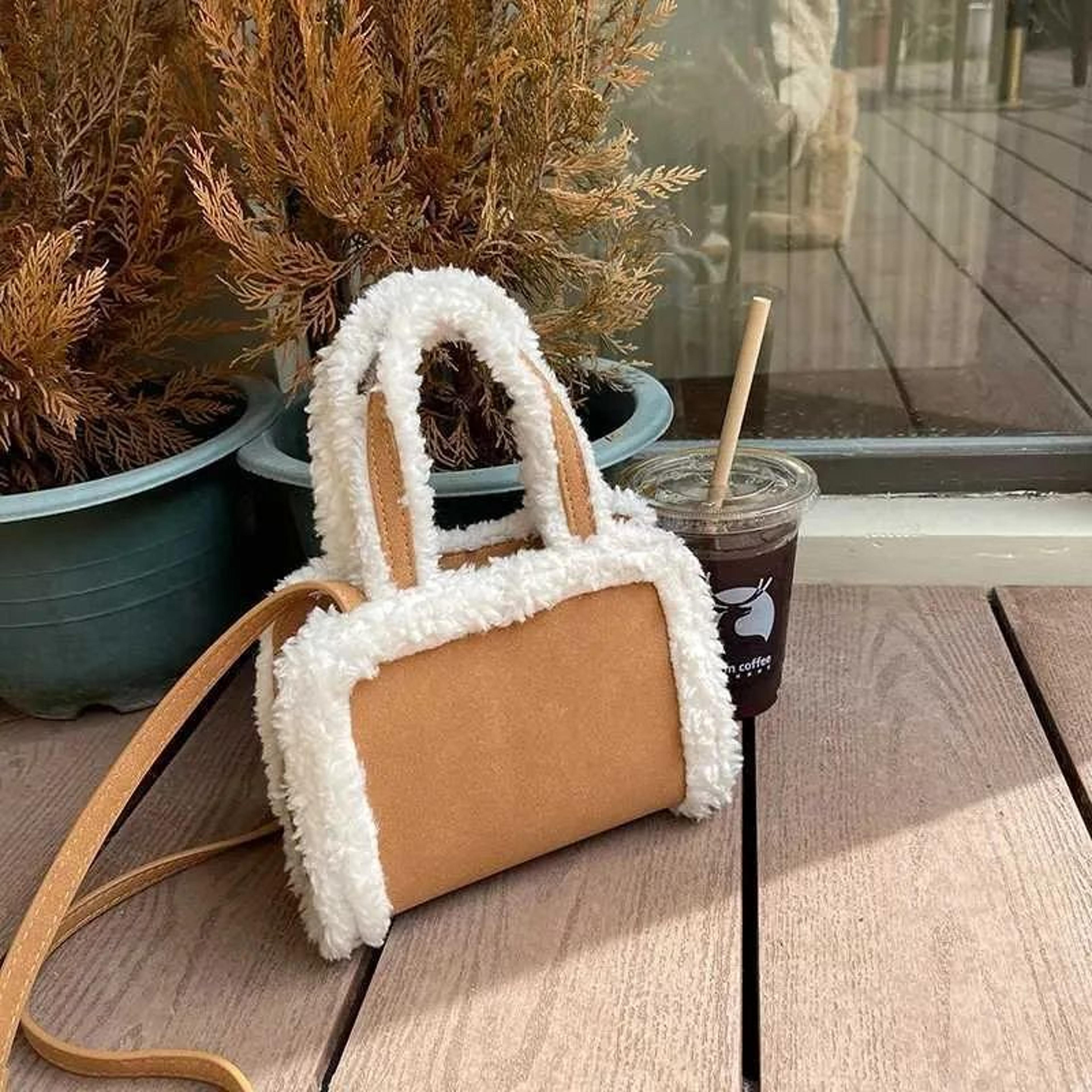 winter plush crossbody bag with wide shoulder strap and zipper closure