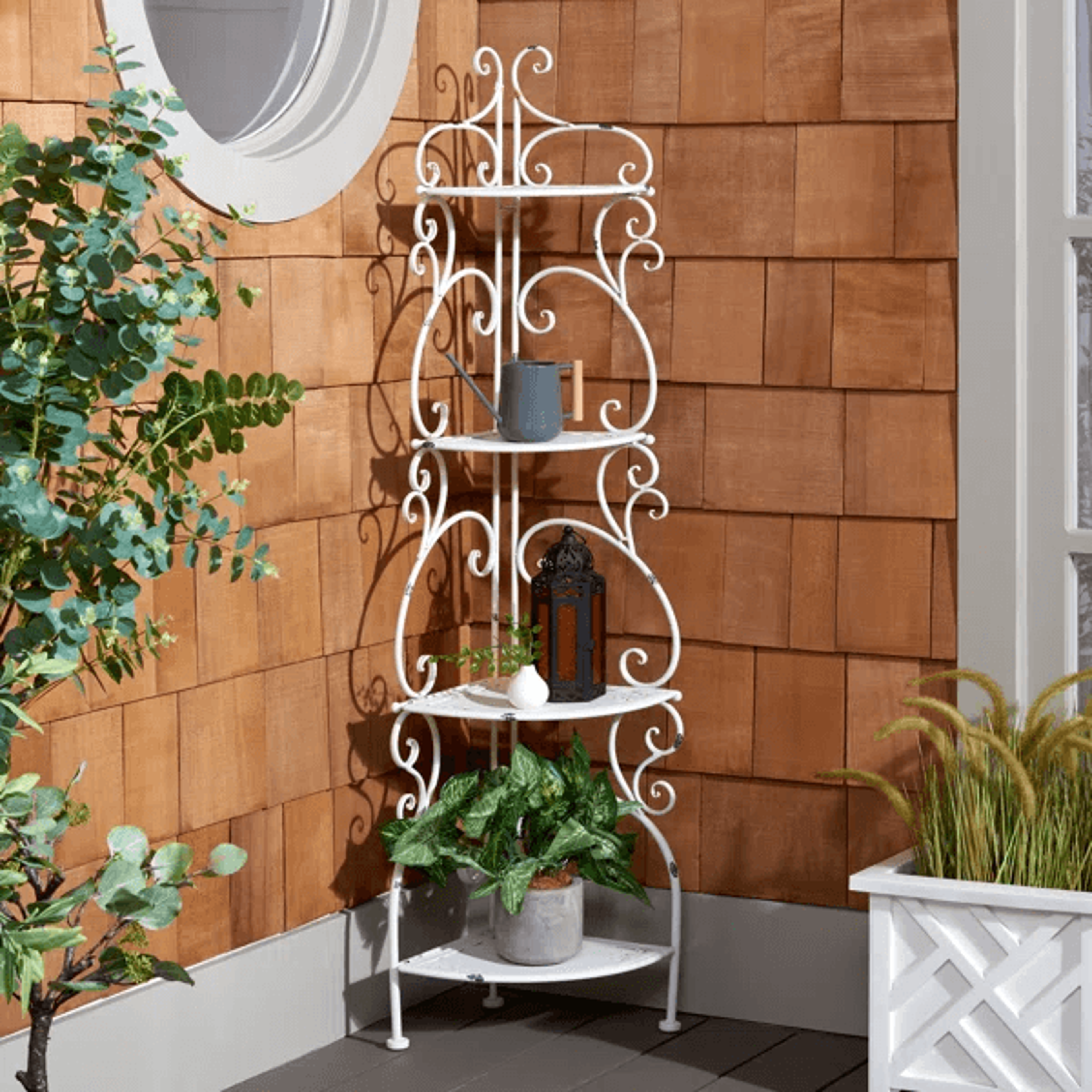 4 tier metal corner plant stand with decorative scrollwork for outdoor spaces