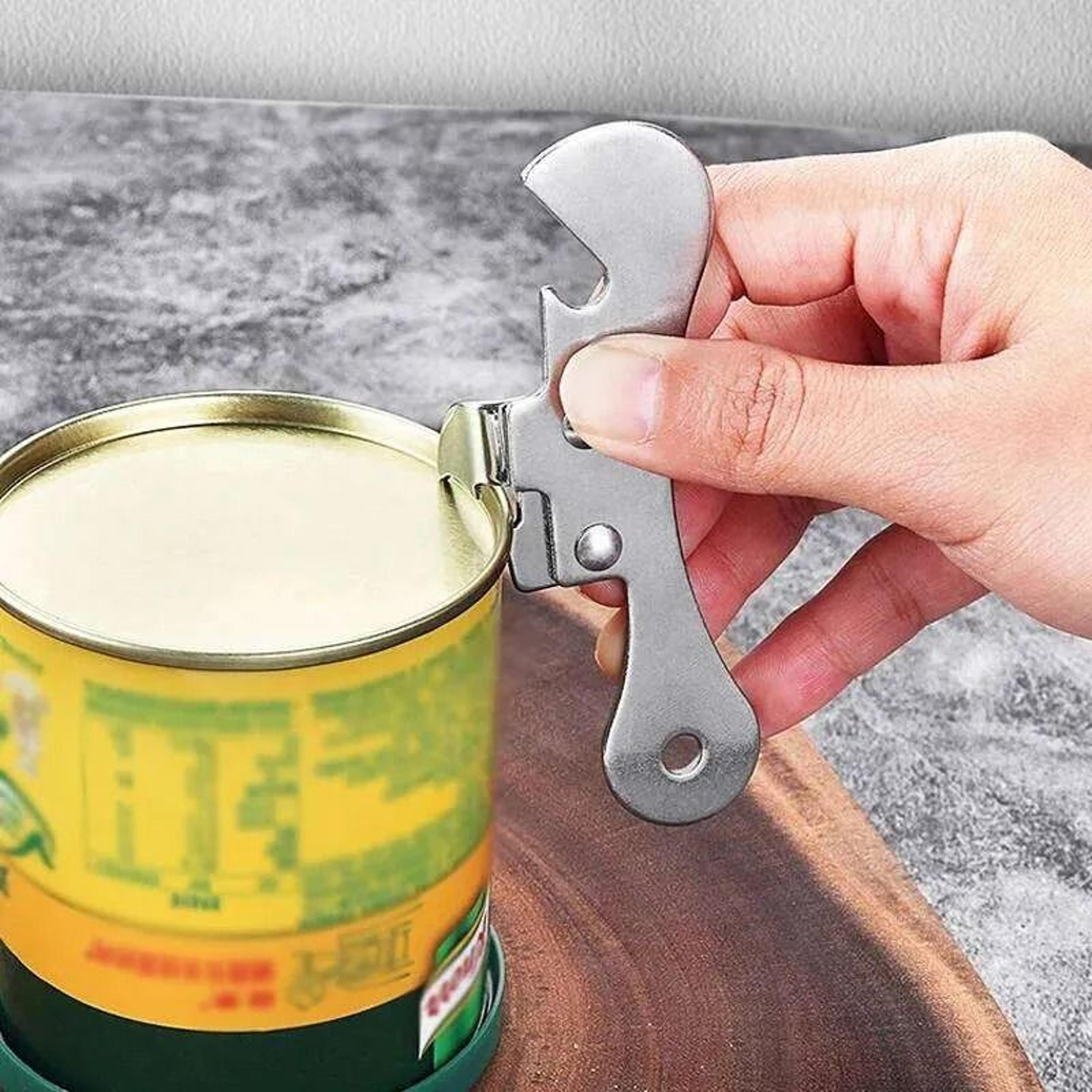 manual can opener with ergonomic grip and integrated cap twisterl