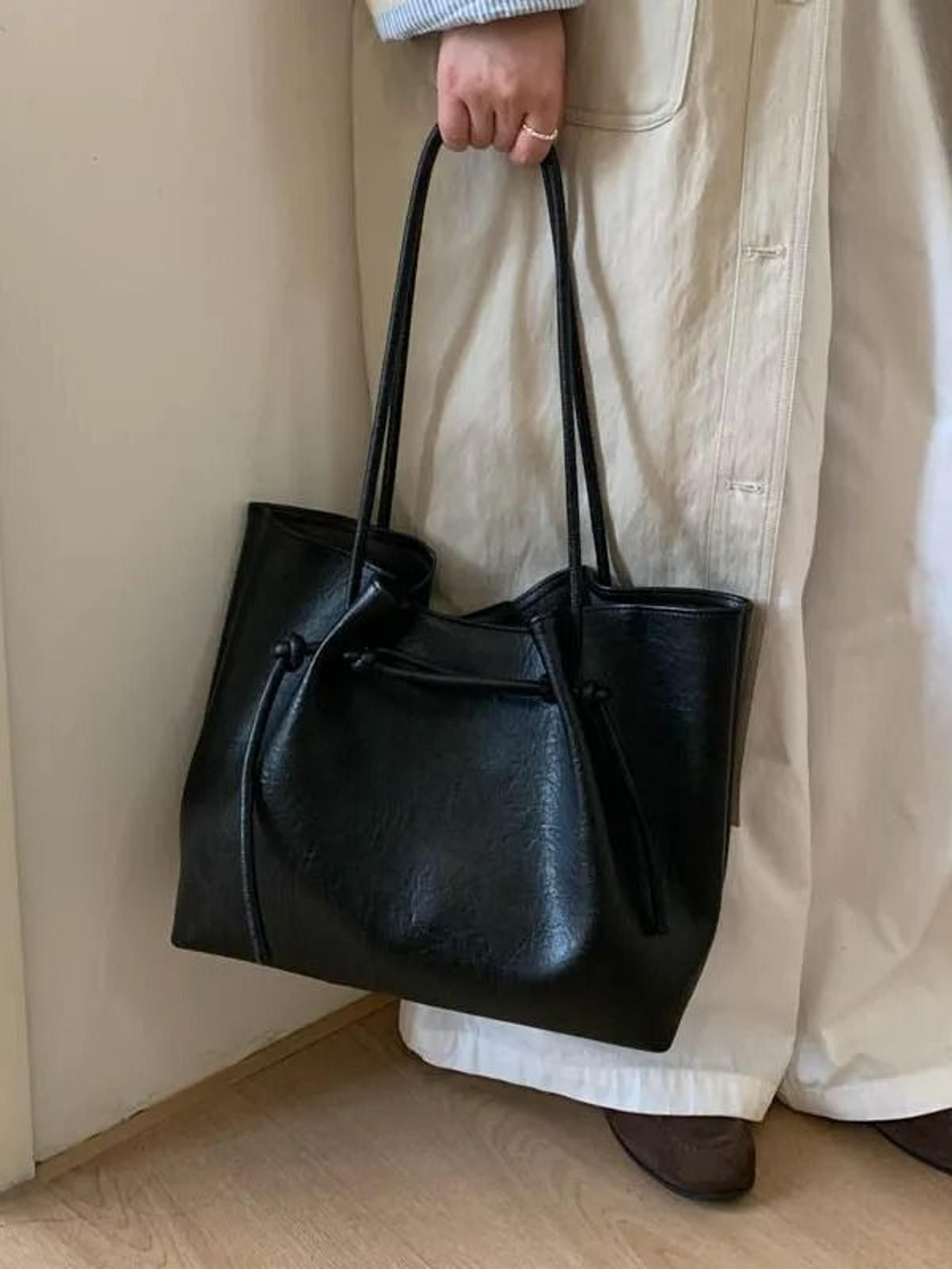brown large bucket shoulder bag with chain strap and zipper closure