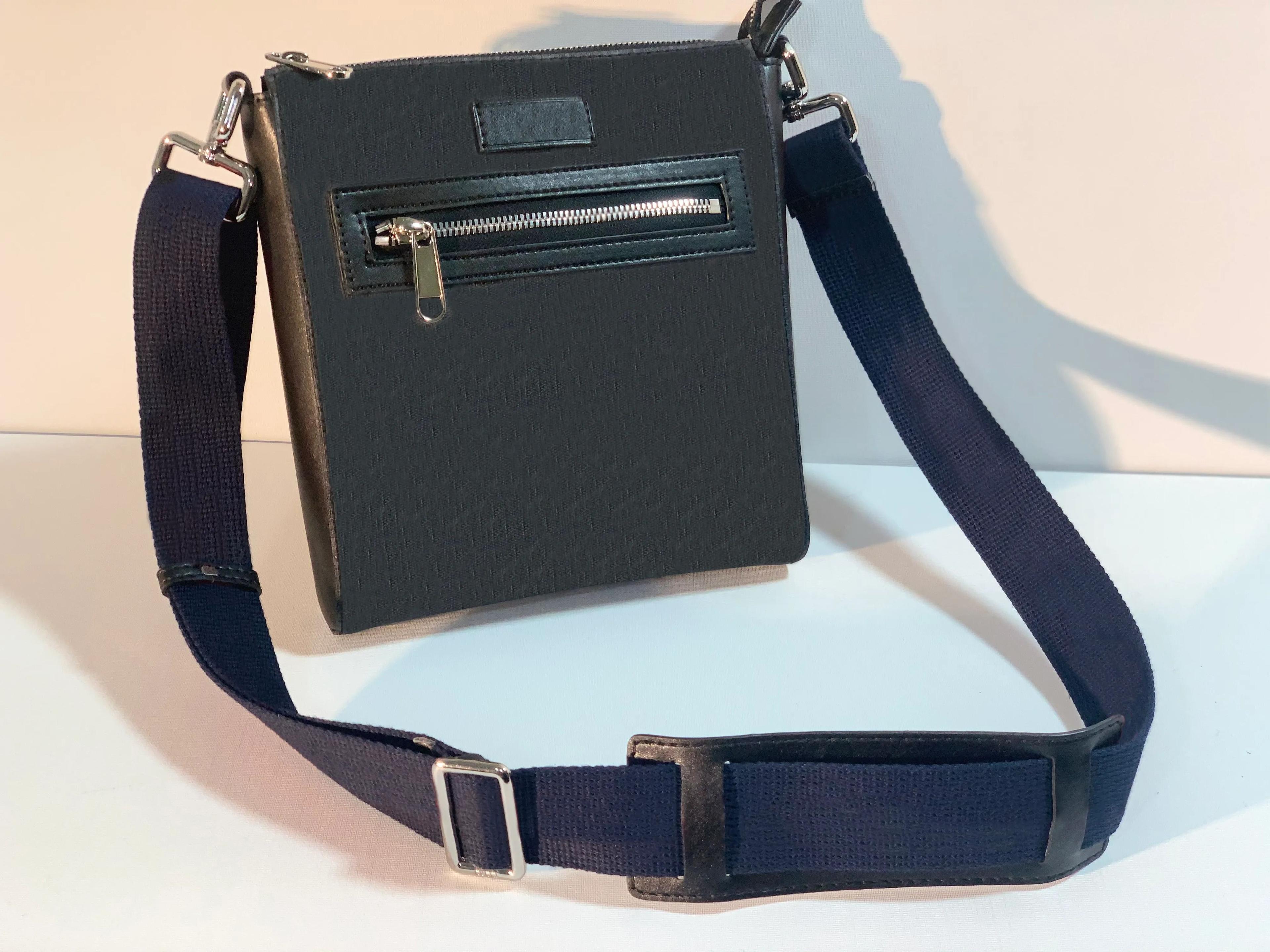 canvas leather messenger bag with star pattern and chain accent