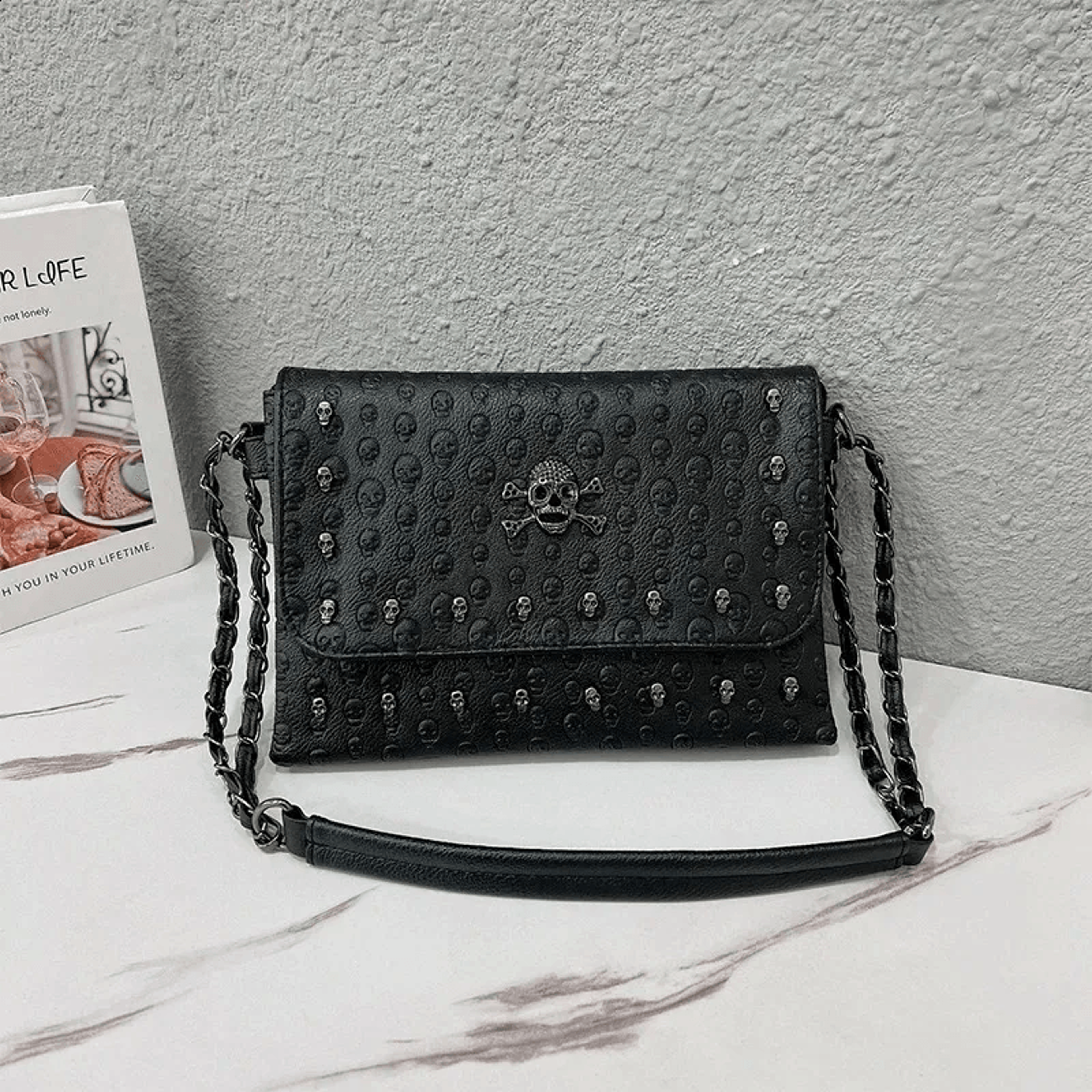 vintage black pu leather crossbody bag with skull flap and rivet details