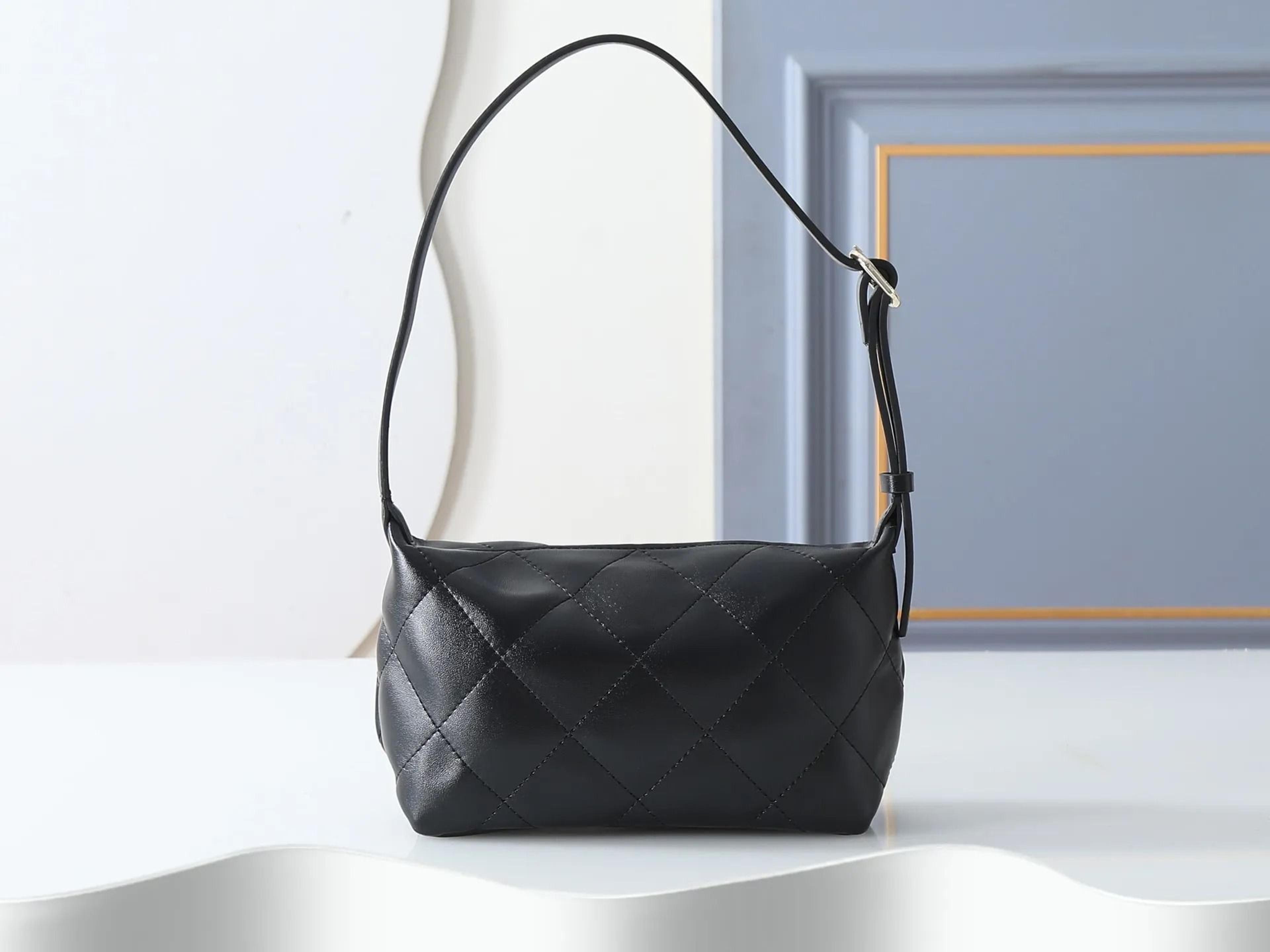 mini sheepskin shoulder bag with light gold metal details