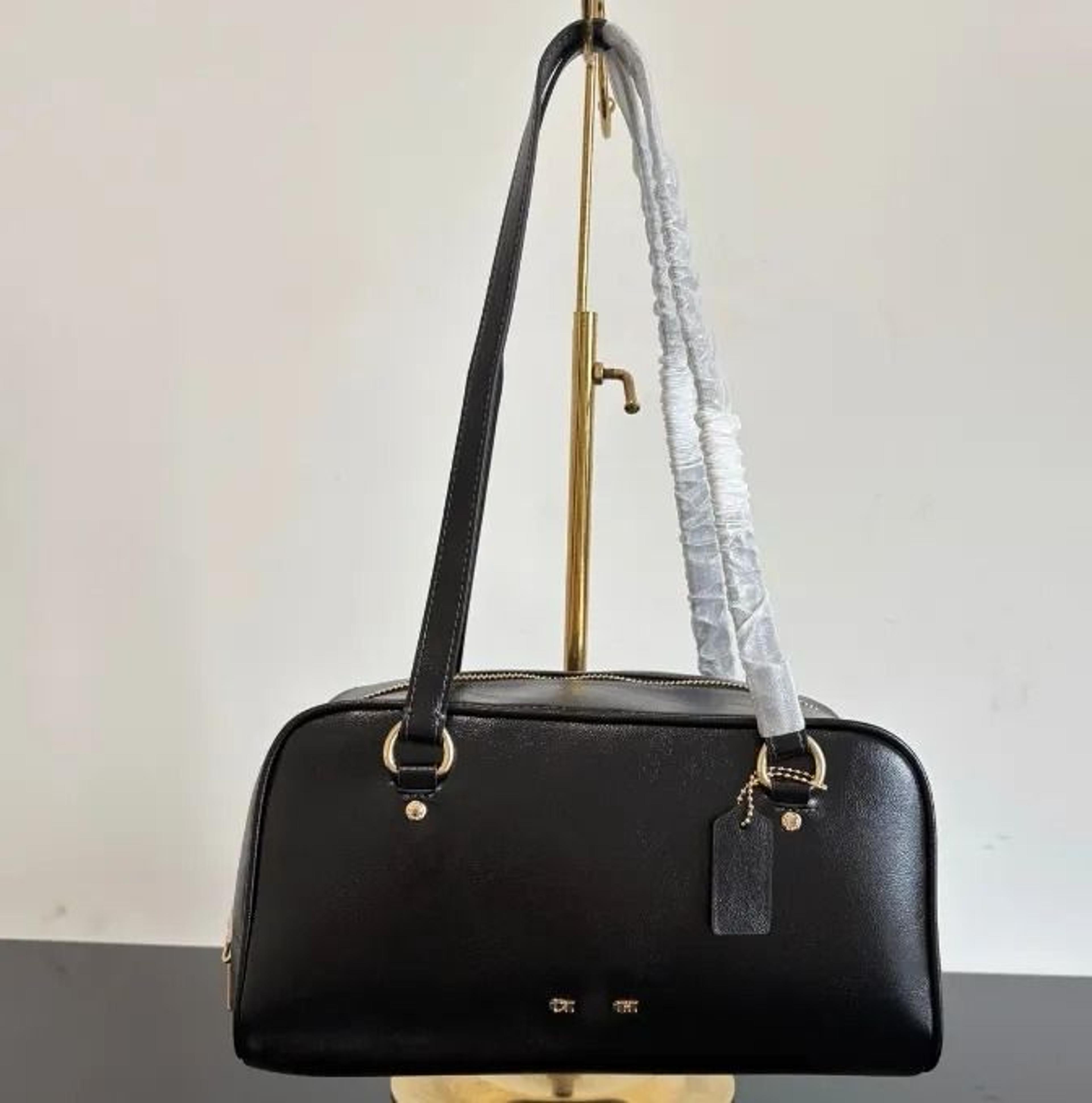 leather shoulder bag with embroidered diamond design and crossbody carry