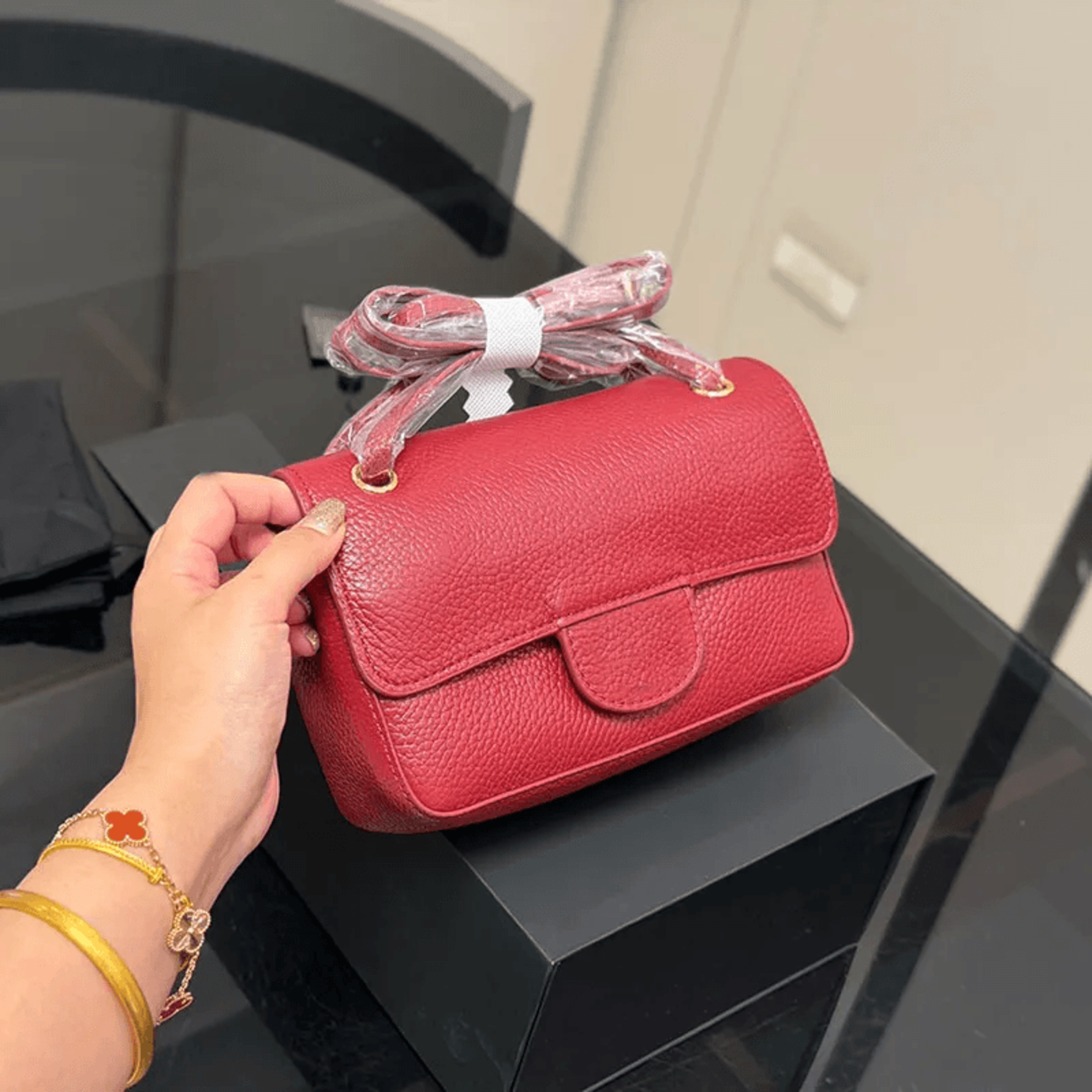 mini leather crossbody bag with chain strap and metal letter buckle