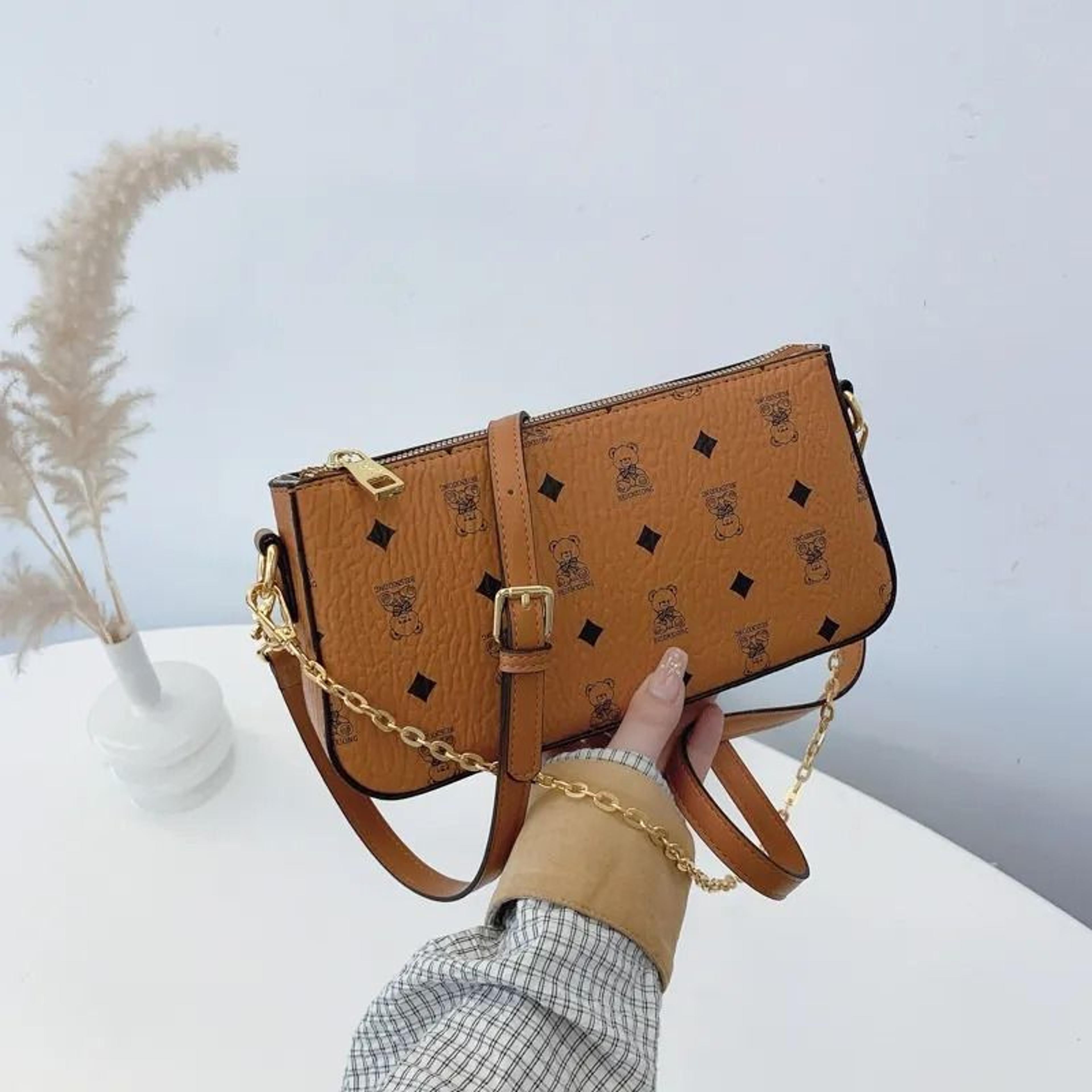women brown envelope crossbody bag with chain shoulder design