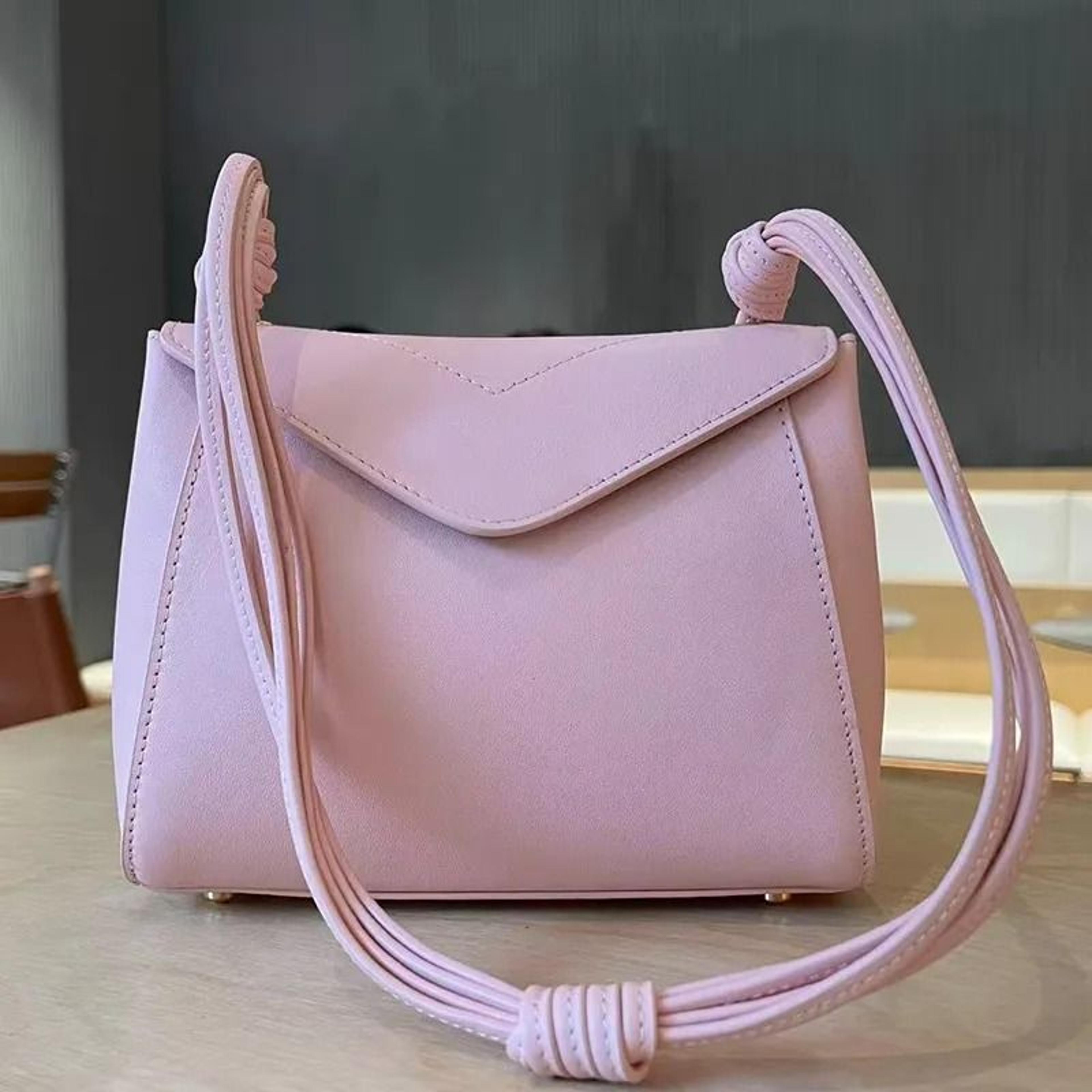 genuine leather crossbody flap bag with braided knotted handle and gold metal lock