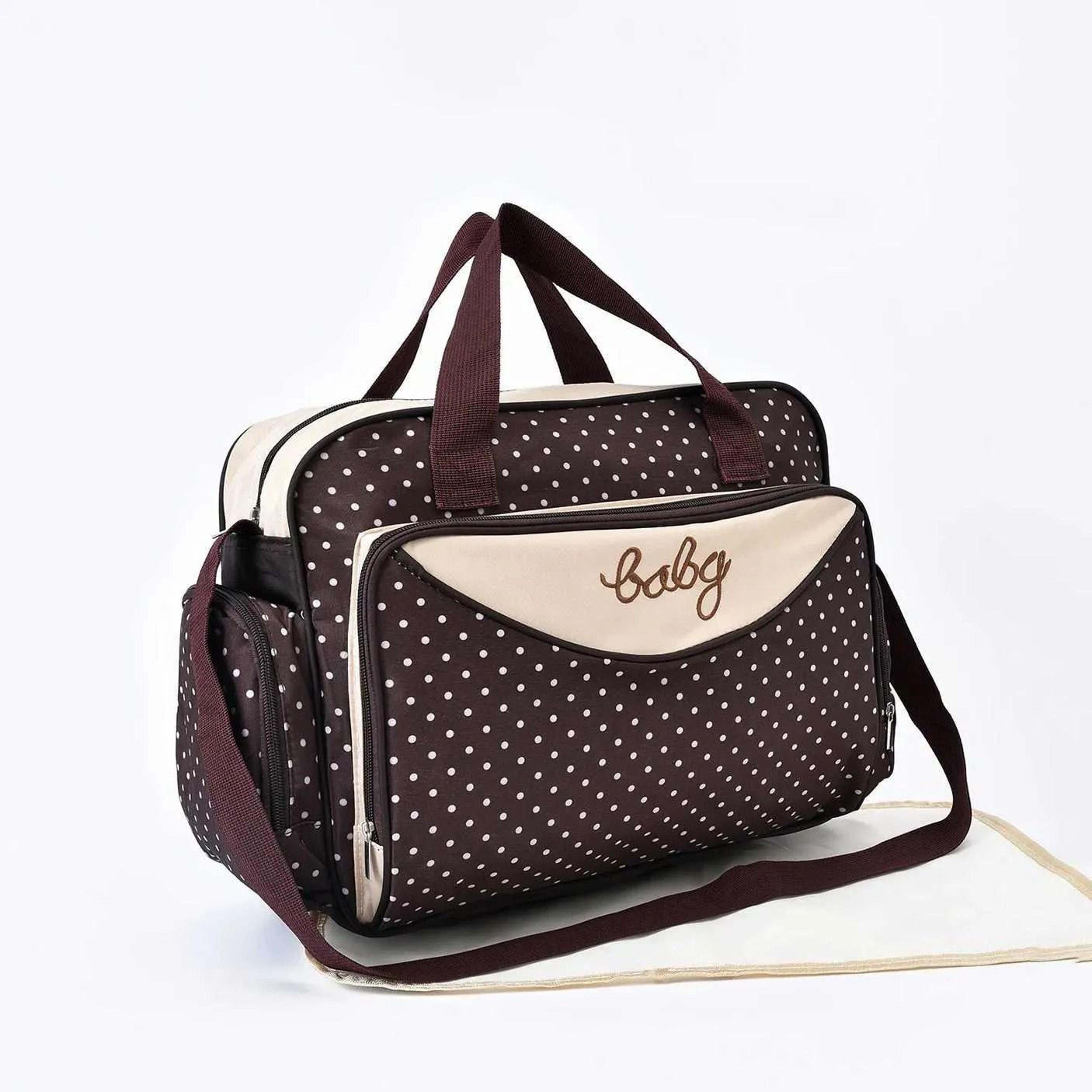 large polka dot diaper bag with shoulder and crossbody carrying options