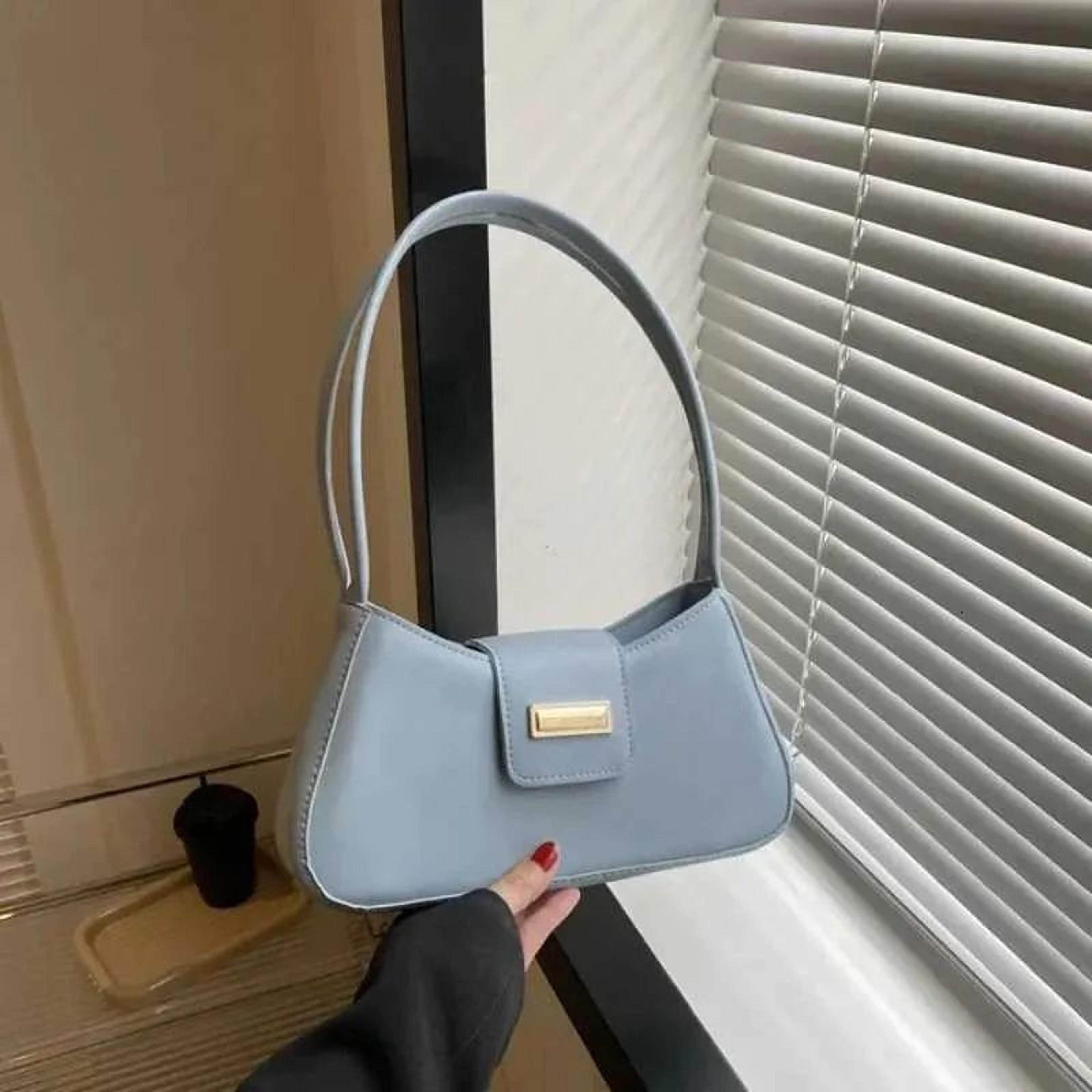 minimalist shoulder bag for women with solid color design and hasp closure