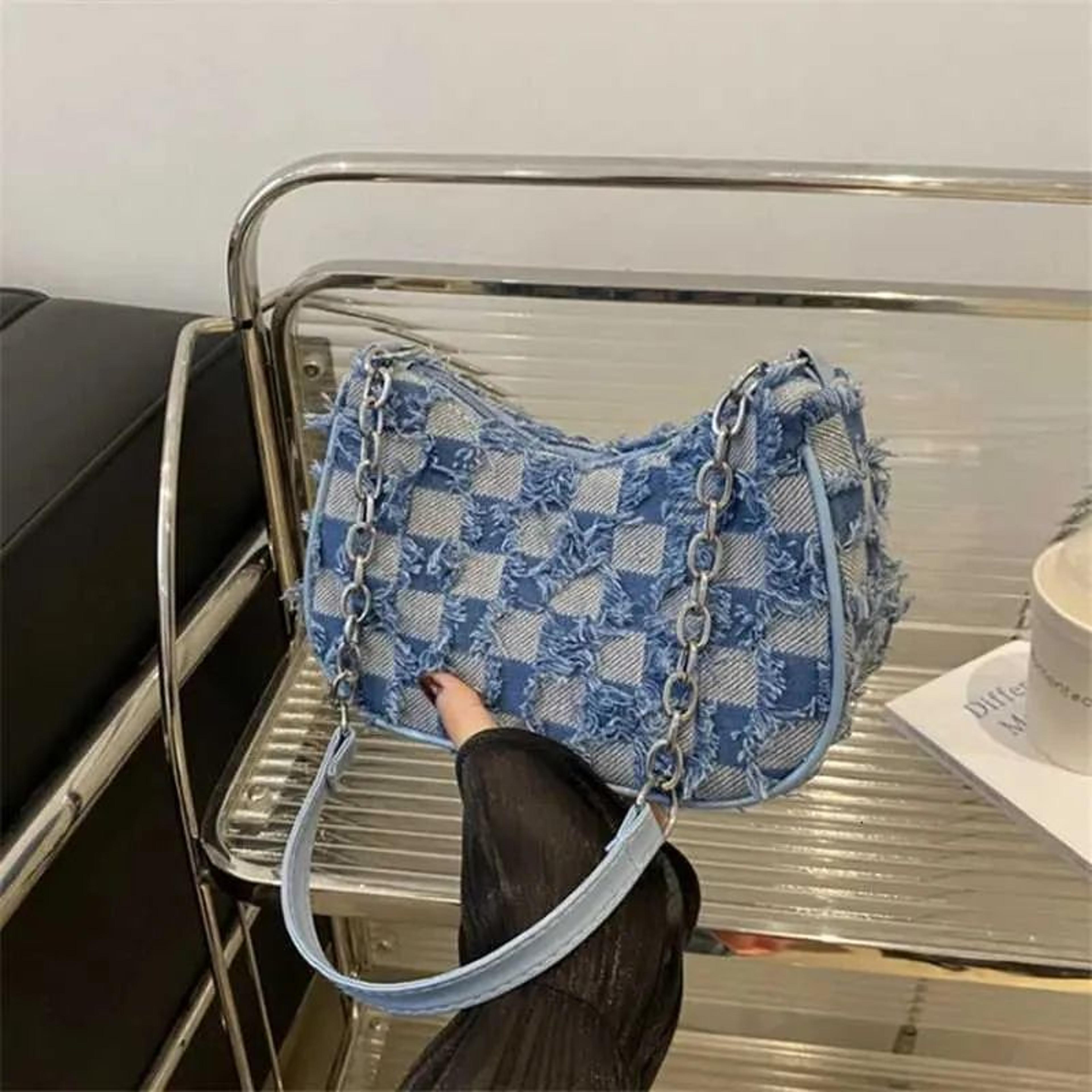 womens blue distressed star pattern tote bag with gold-tone hardware