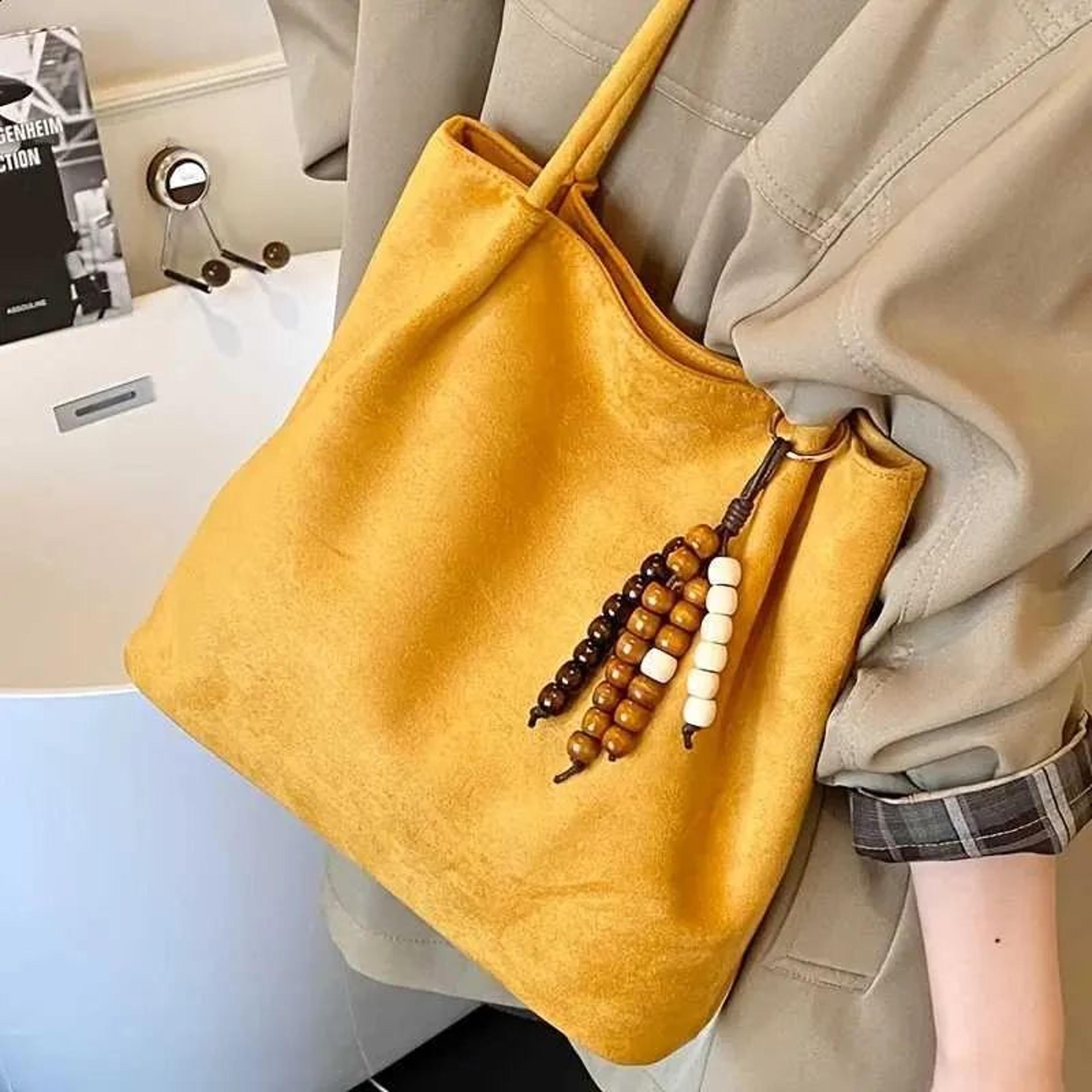 suede crossbody shoulder bag with vintage wooden bead pendant