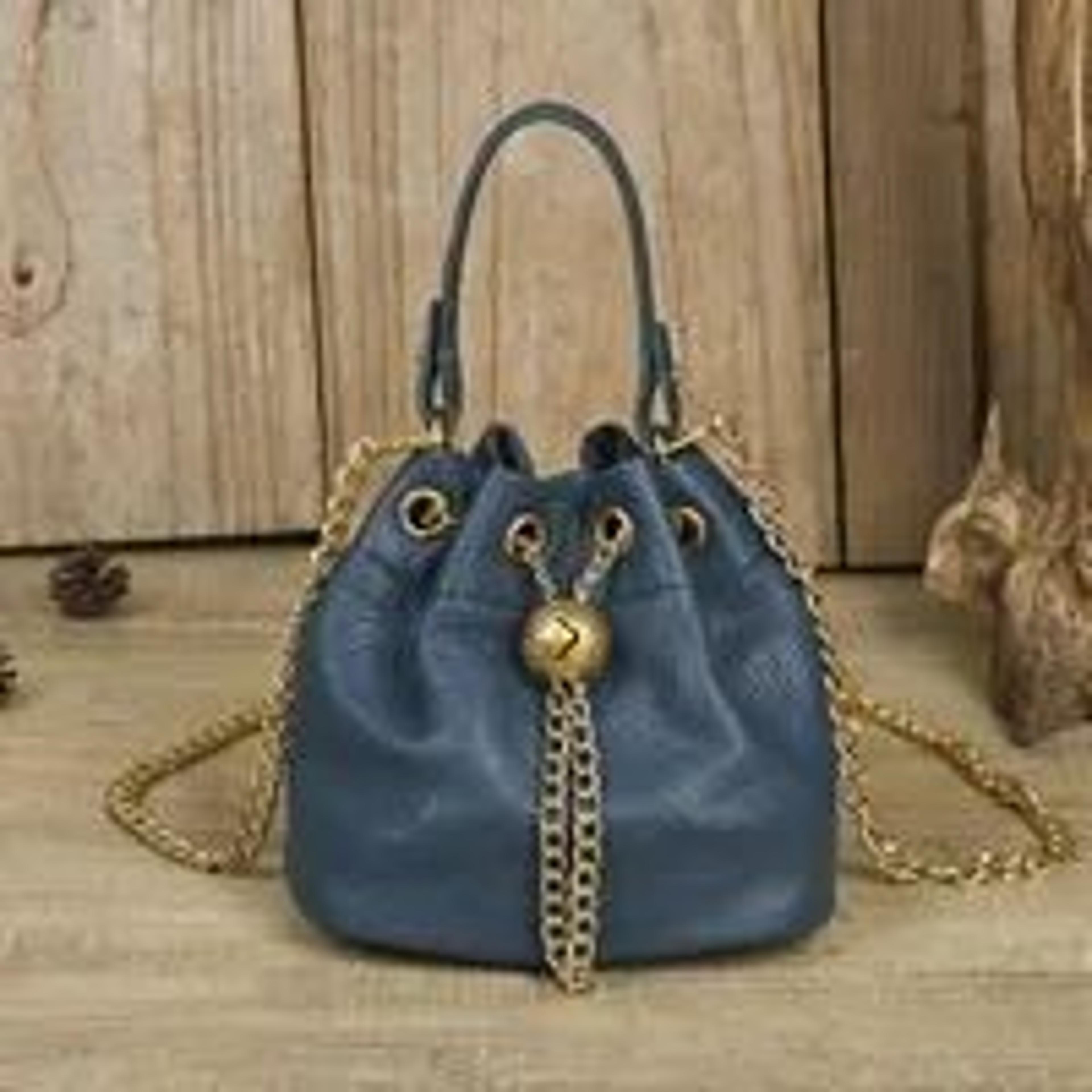 women soft cowhide bucket bag with adjustable chain strap and gold ball accent
