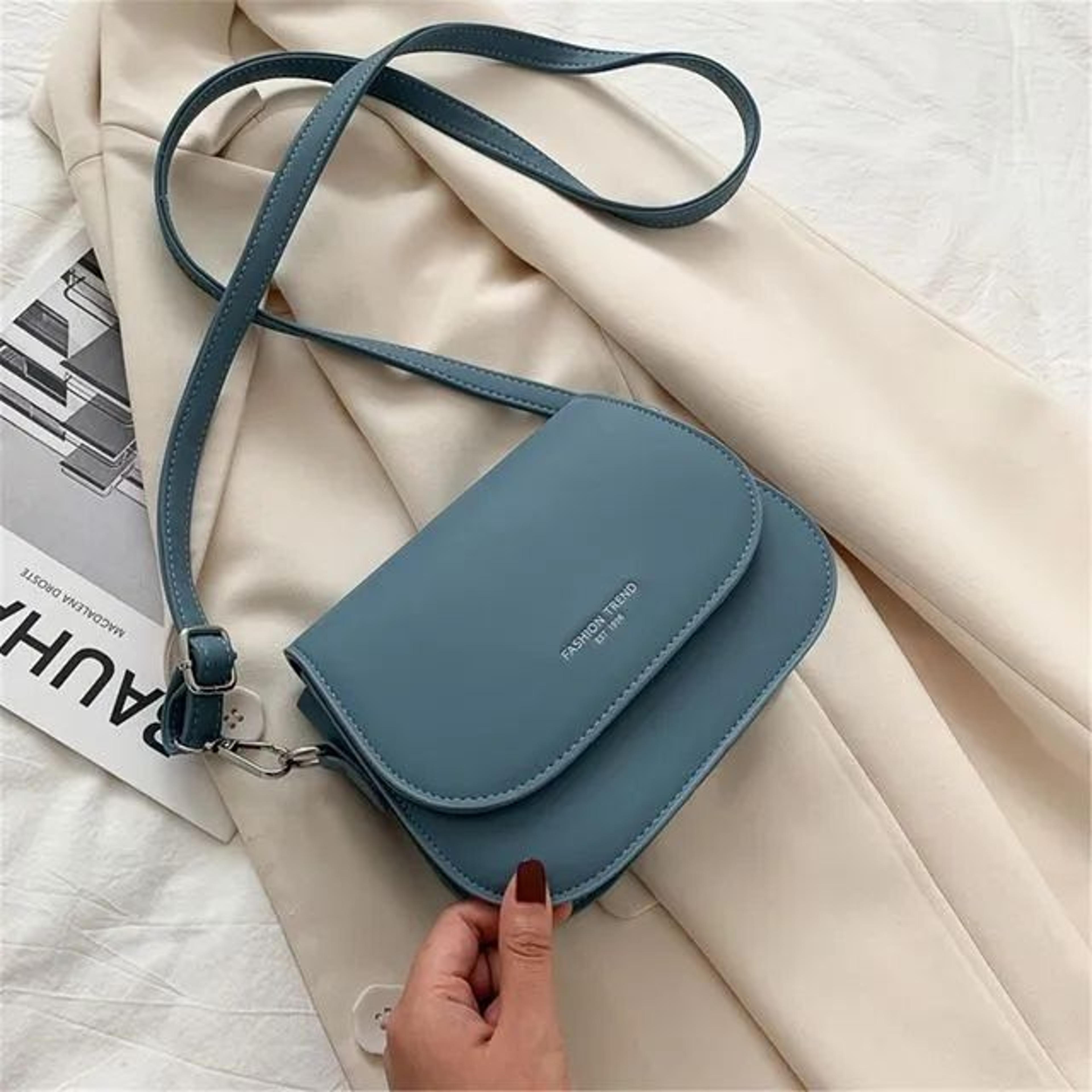 women small crossbody bag with adjustable strap and solid color flap design