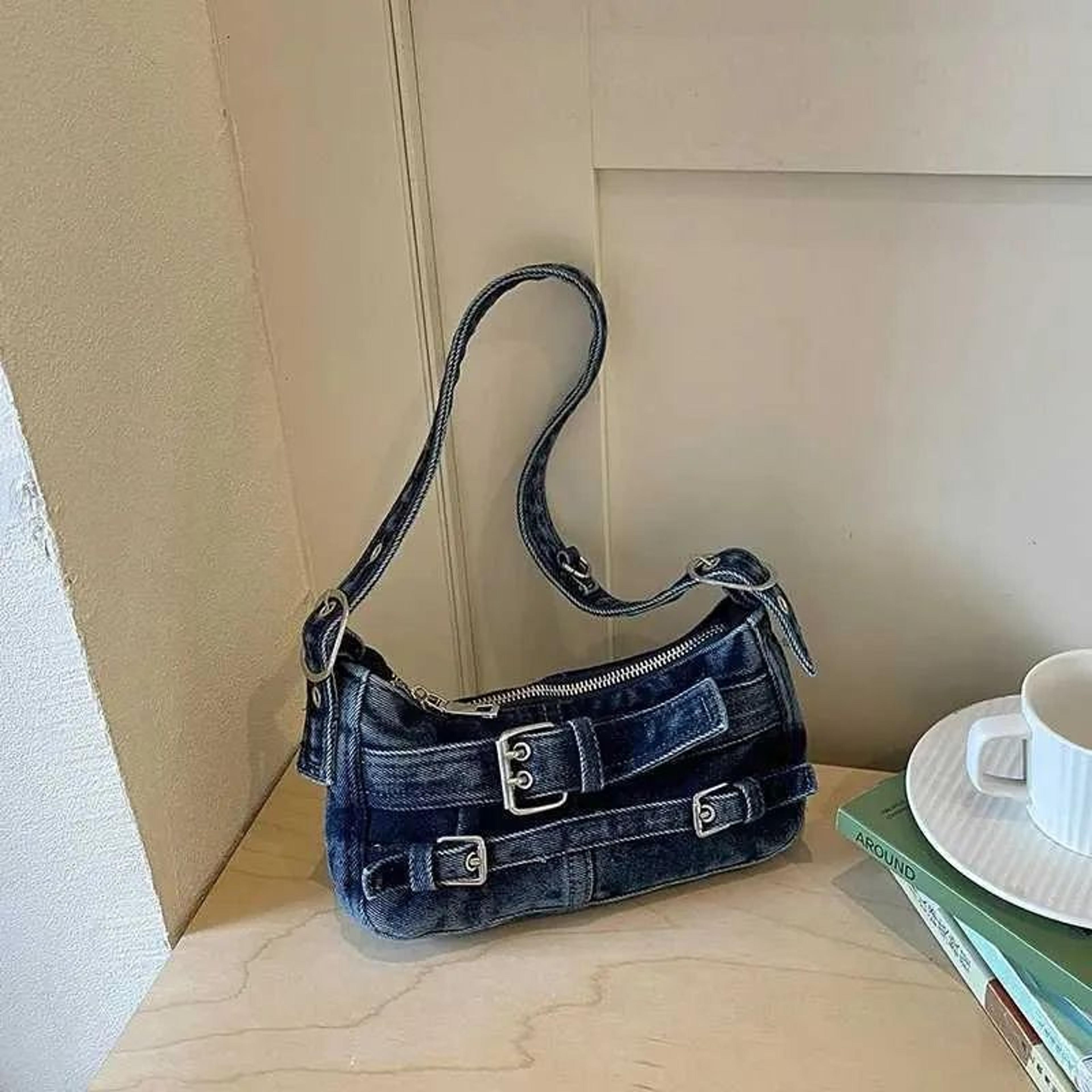 vintage washed denim shoulder bag with belt buckle detail for women