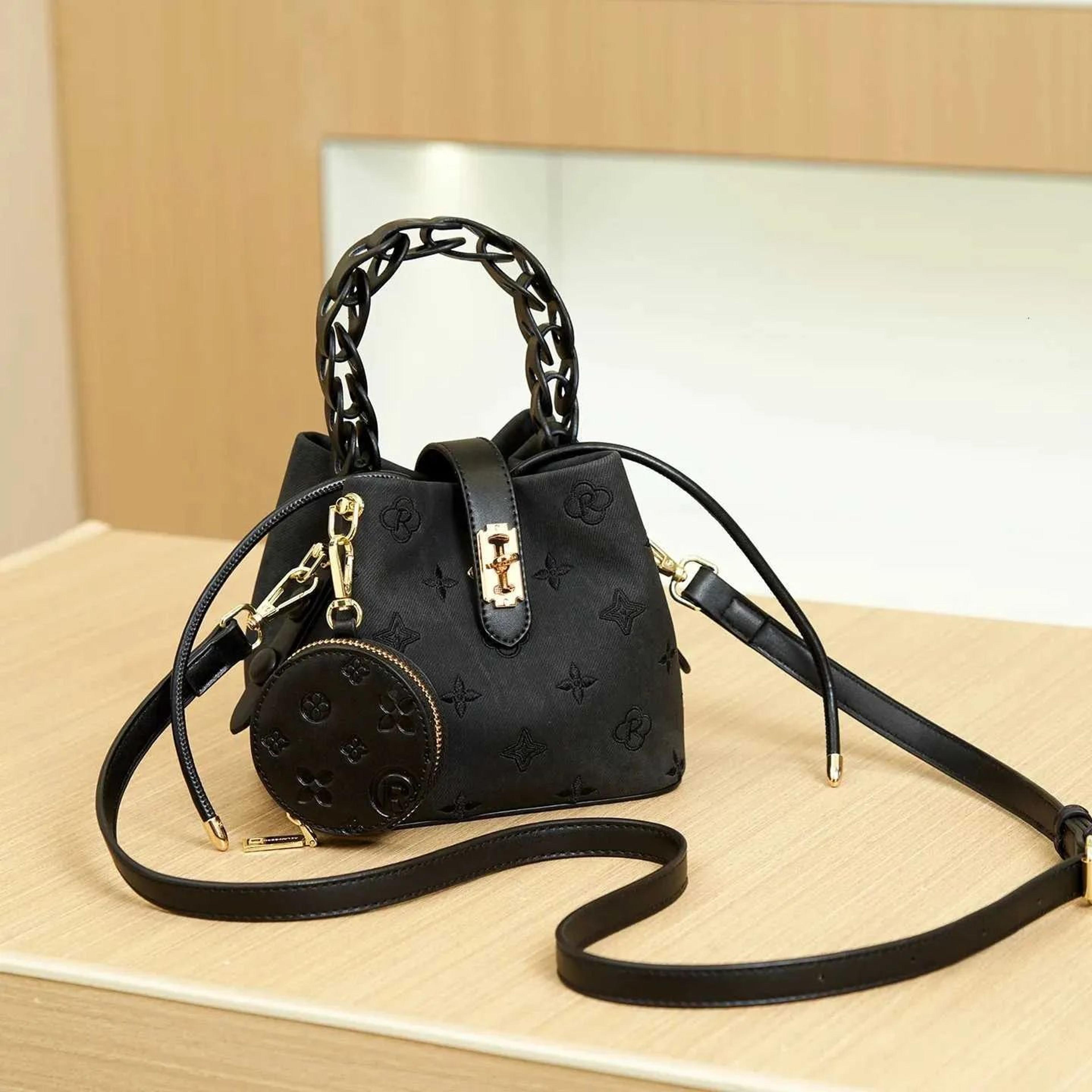 mini bucket crossbody bag with woven texture and phone pouch design
