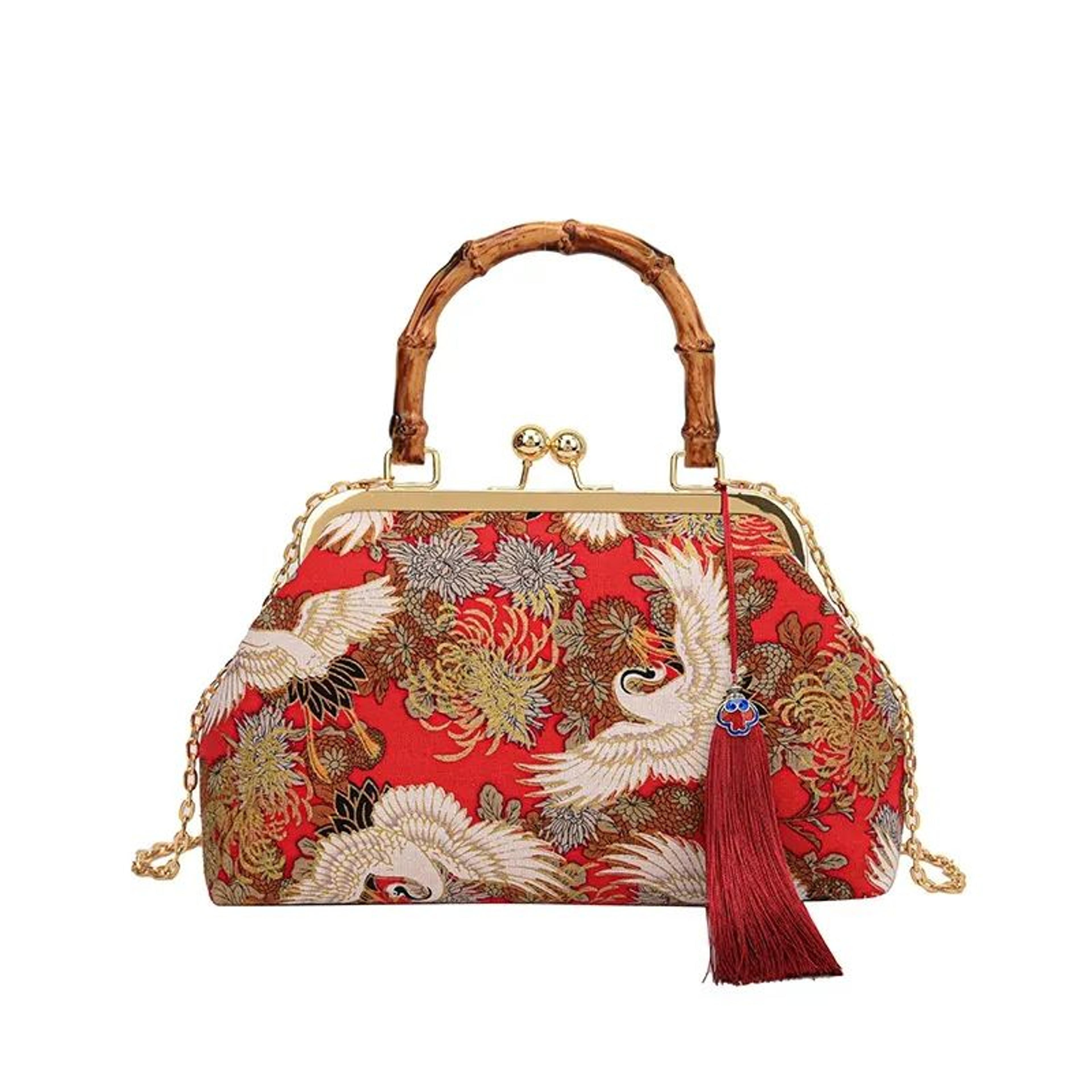 embroidered kiss-lock crossbody handbag with vintage chain strap