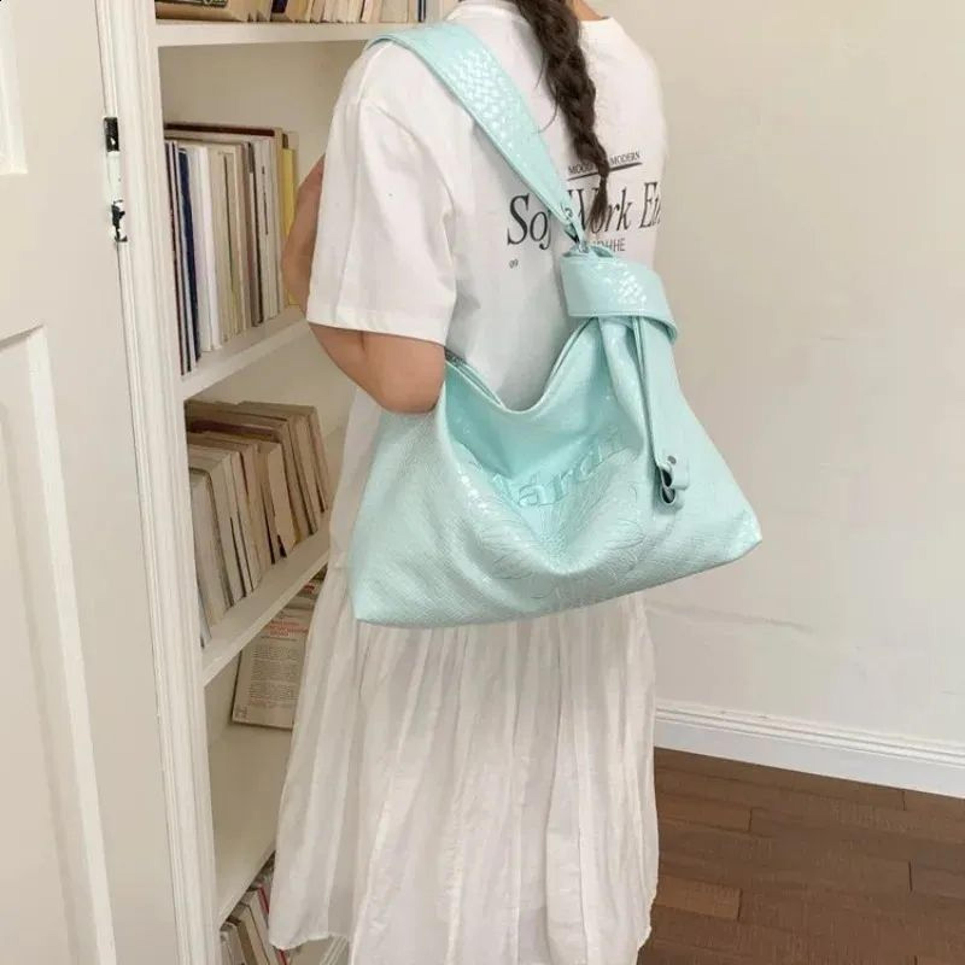 glossy pu leather shoulder bag with adjustable strap and daisy detail
