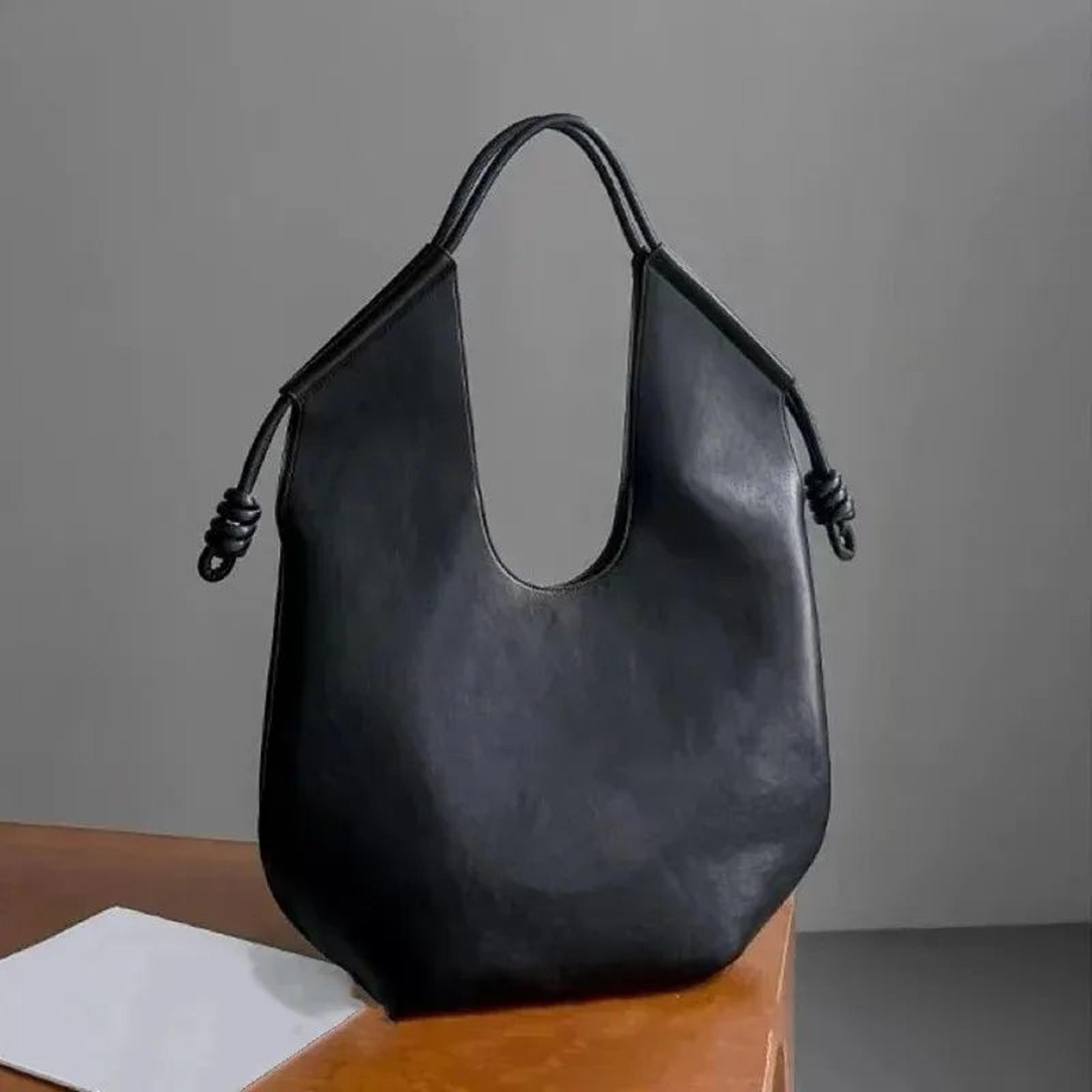 pu leather tote bag with adjustable shoulder strap and zipper closure