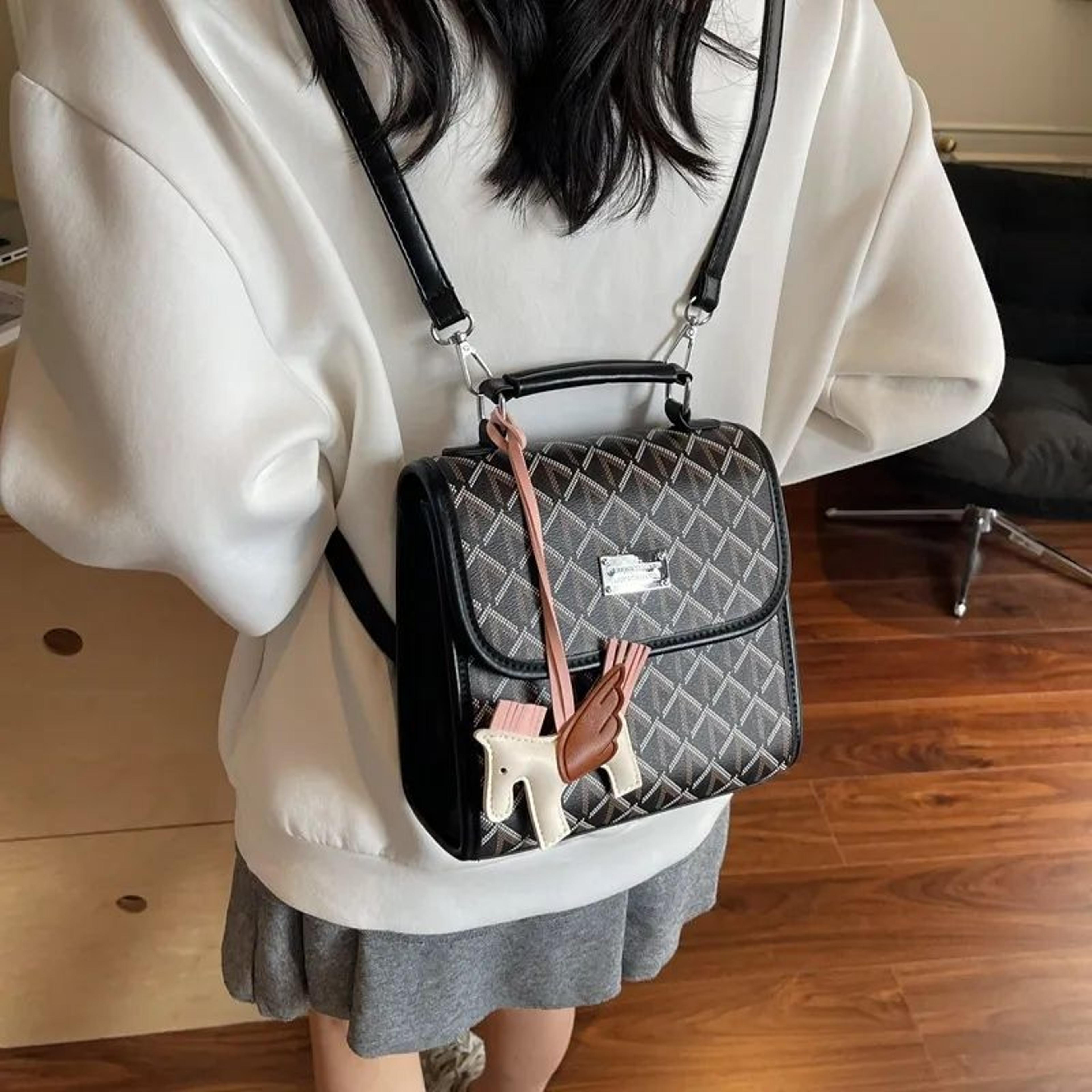 womens printed backpack with handheld design