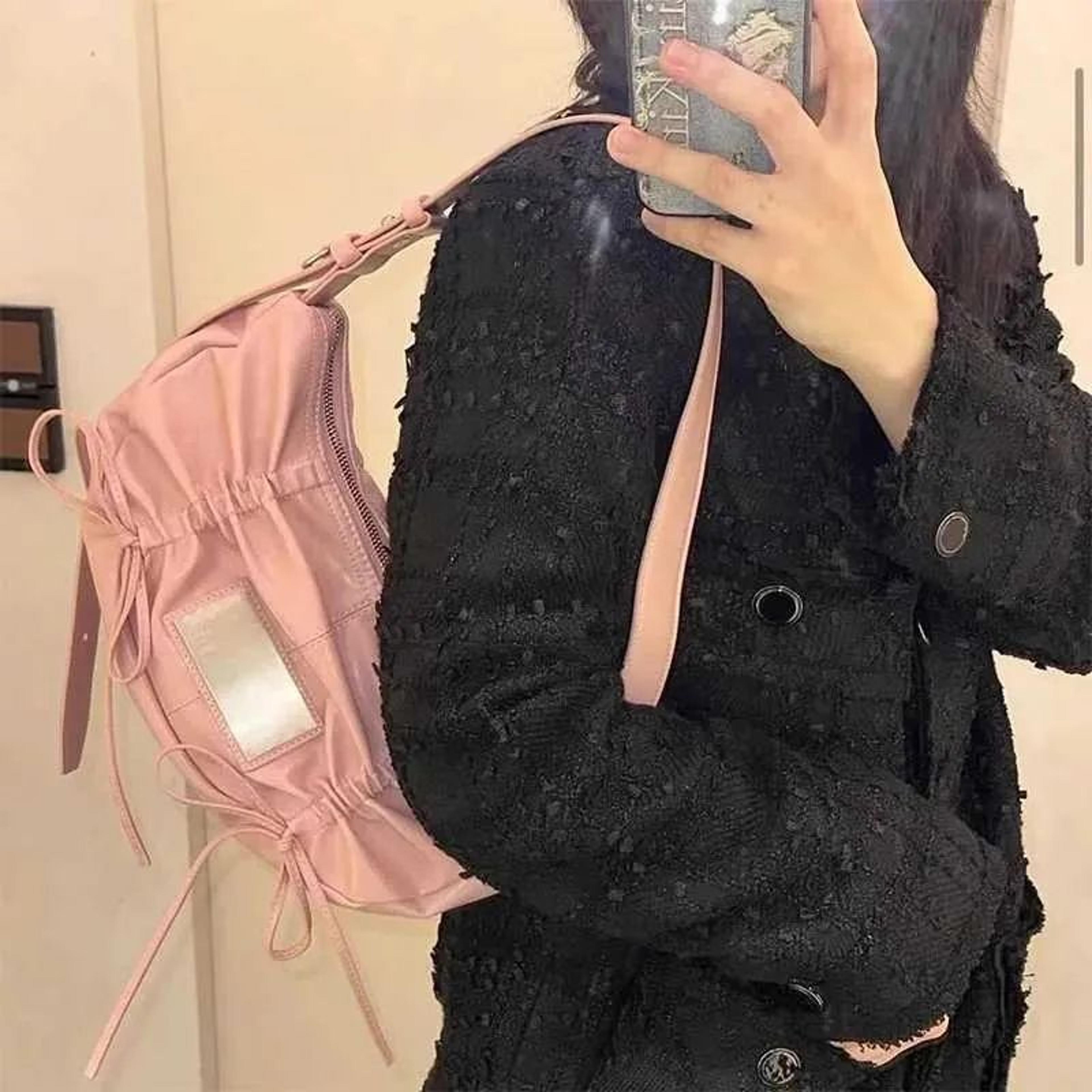 womens pleated cloud shoulder bag with drawstring and soft leather design