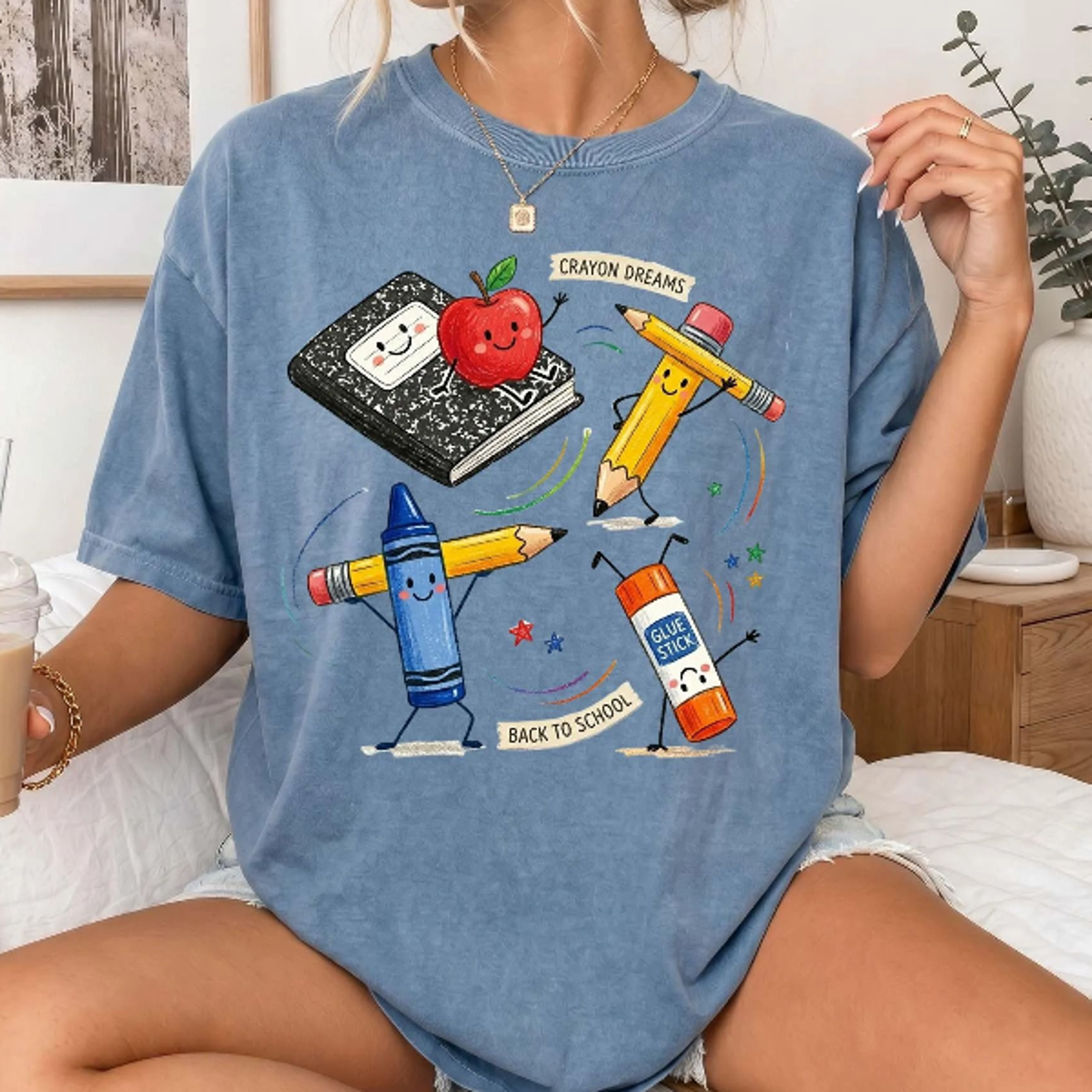 cute back to school teacher shirt with colorful crayon, pencil, notebook, apple, and glue stick graphics. perfect for te