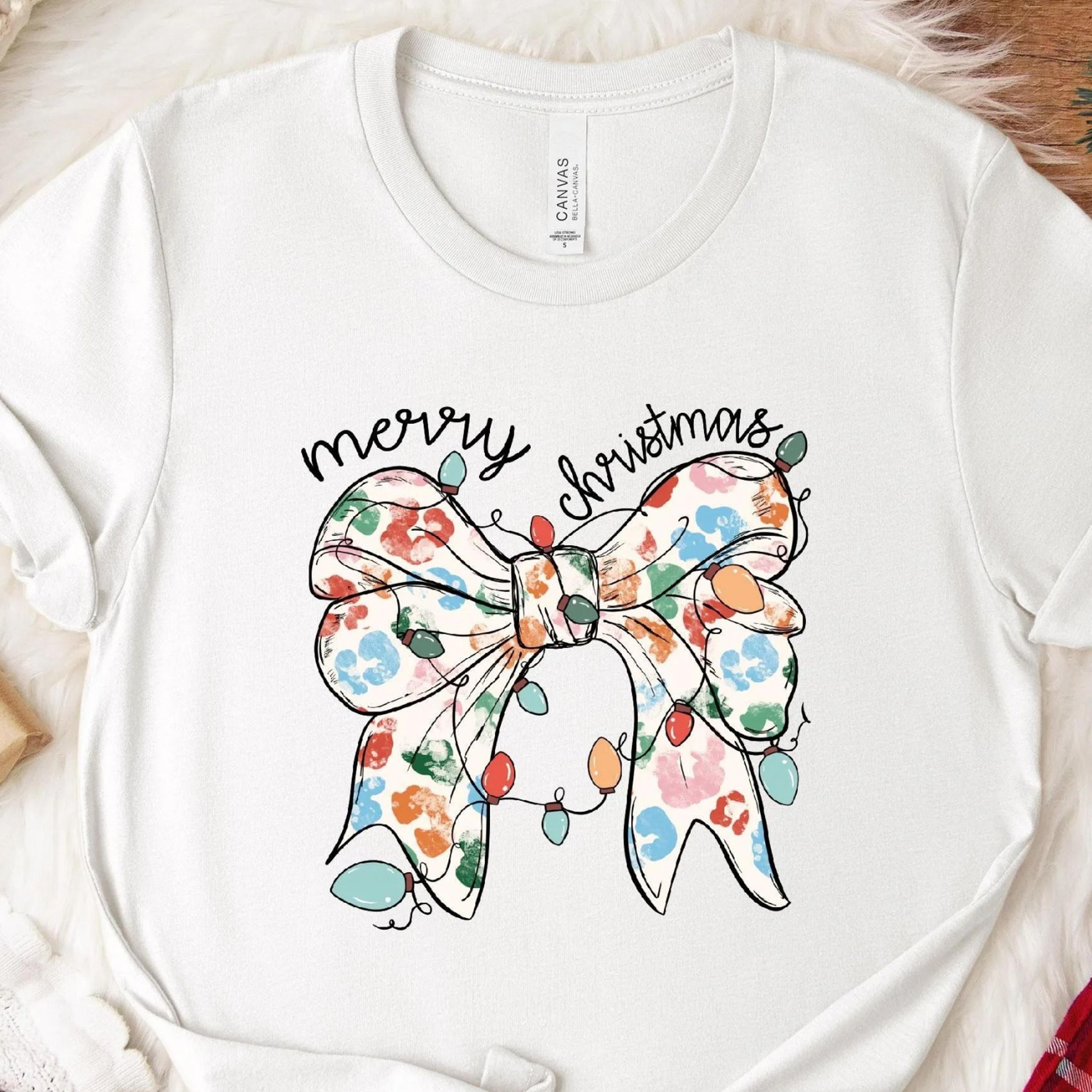 coquette christmas bow t-shirt festive holiday lights tee