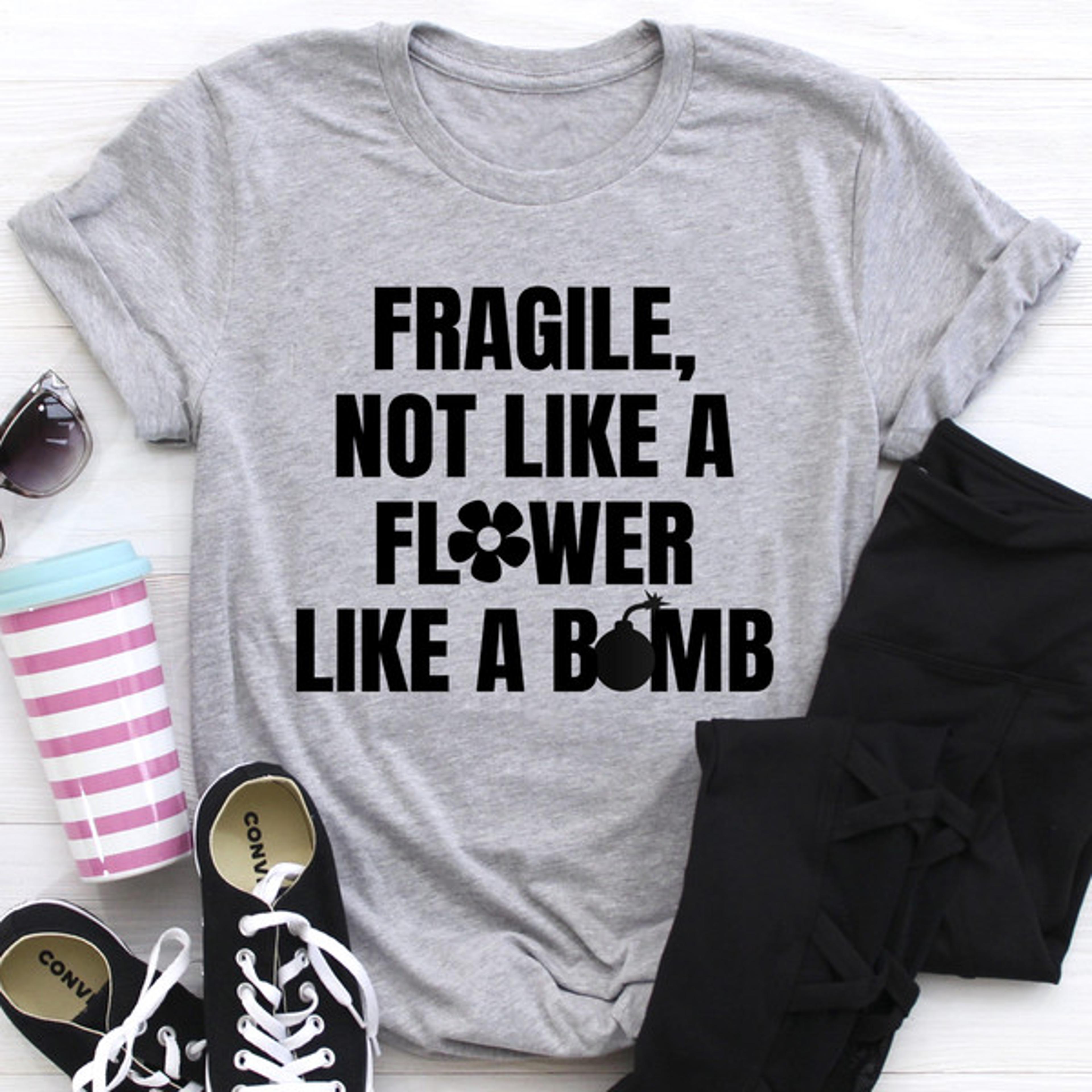 fragile not like a flower tee