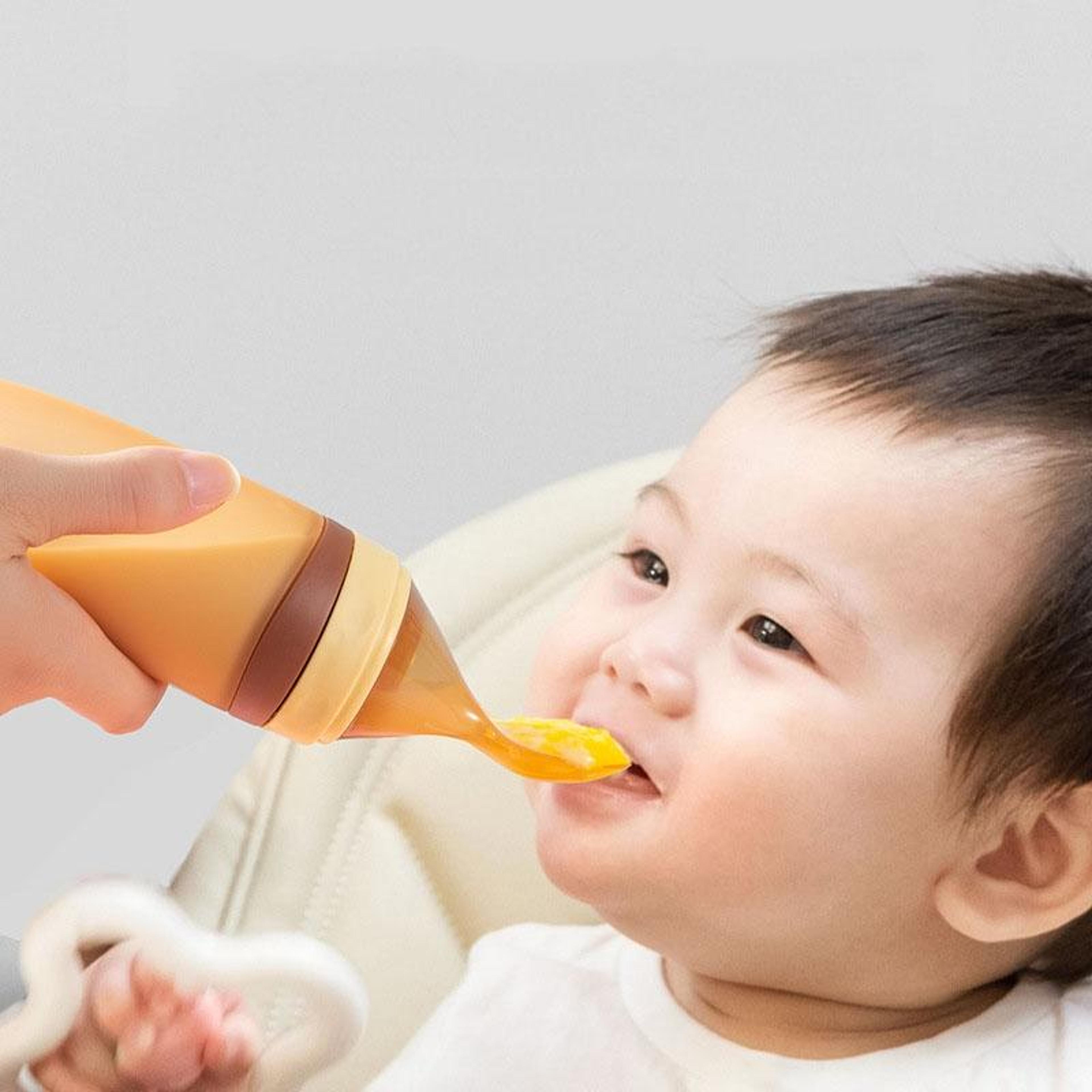 silicone baby feeding spoon bottle, soft squeeze rice paste dispenser for infants