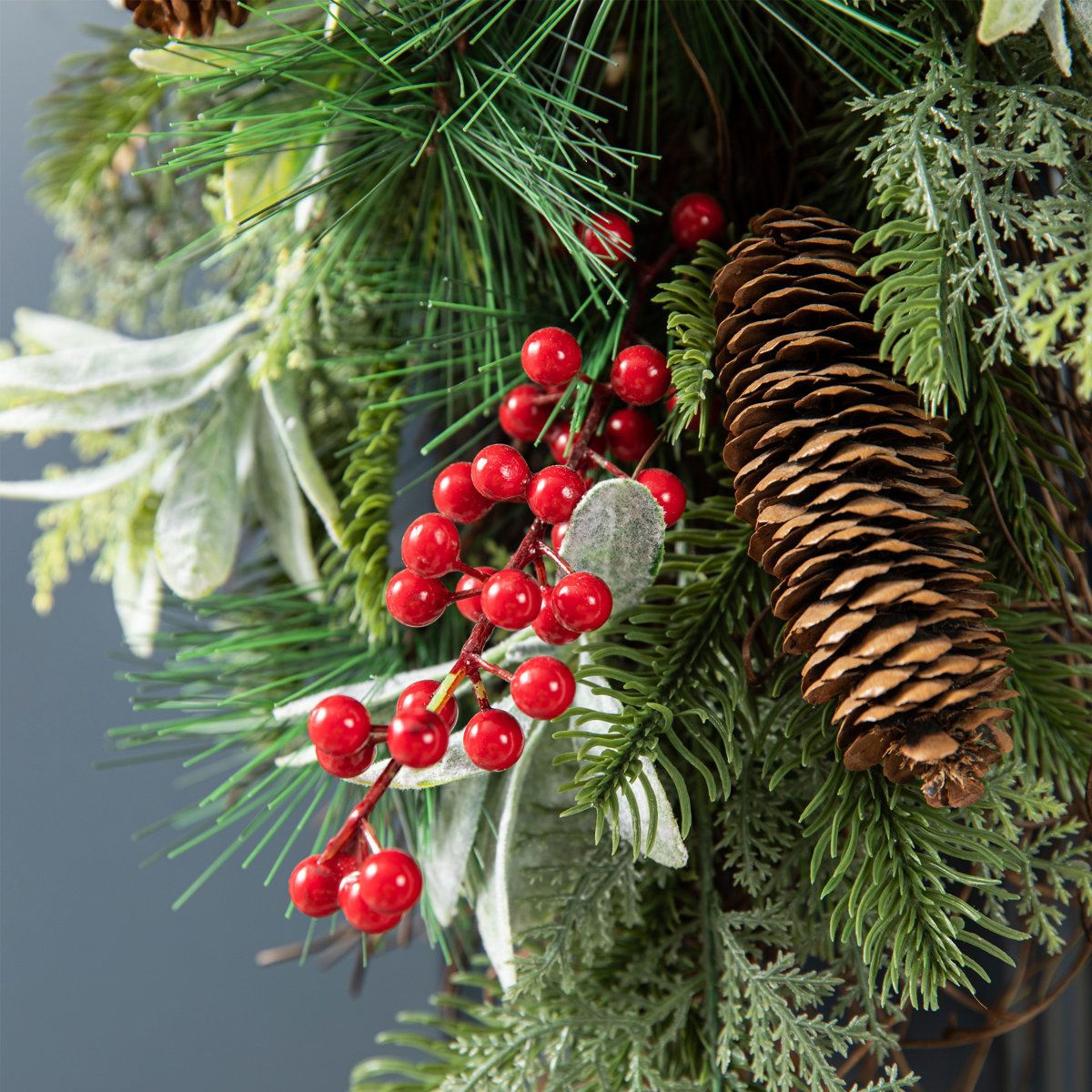 Frosted Pinecone Door Swag With Red Berries And Bells 1