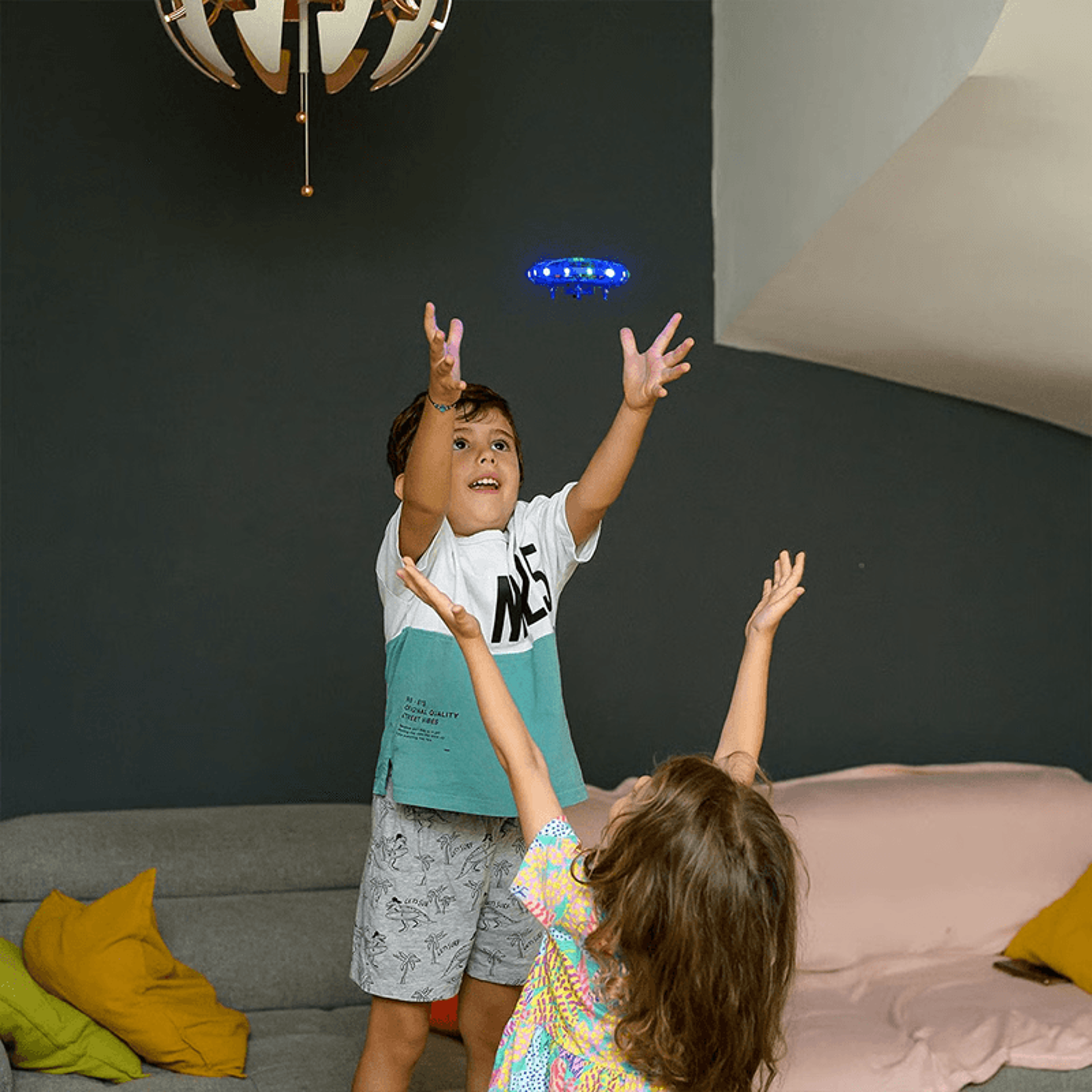 Kids enjoying interactive play with LED UFO drone toy