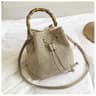 Woven Straw Bucket Bag For Women With Bamboo Handle And Crossbody Design 1